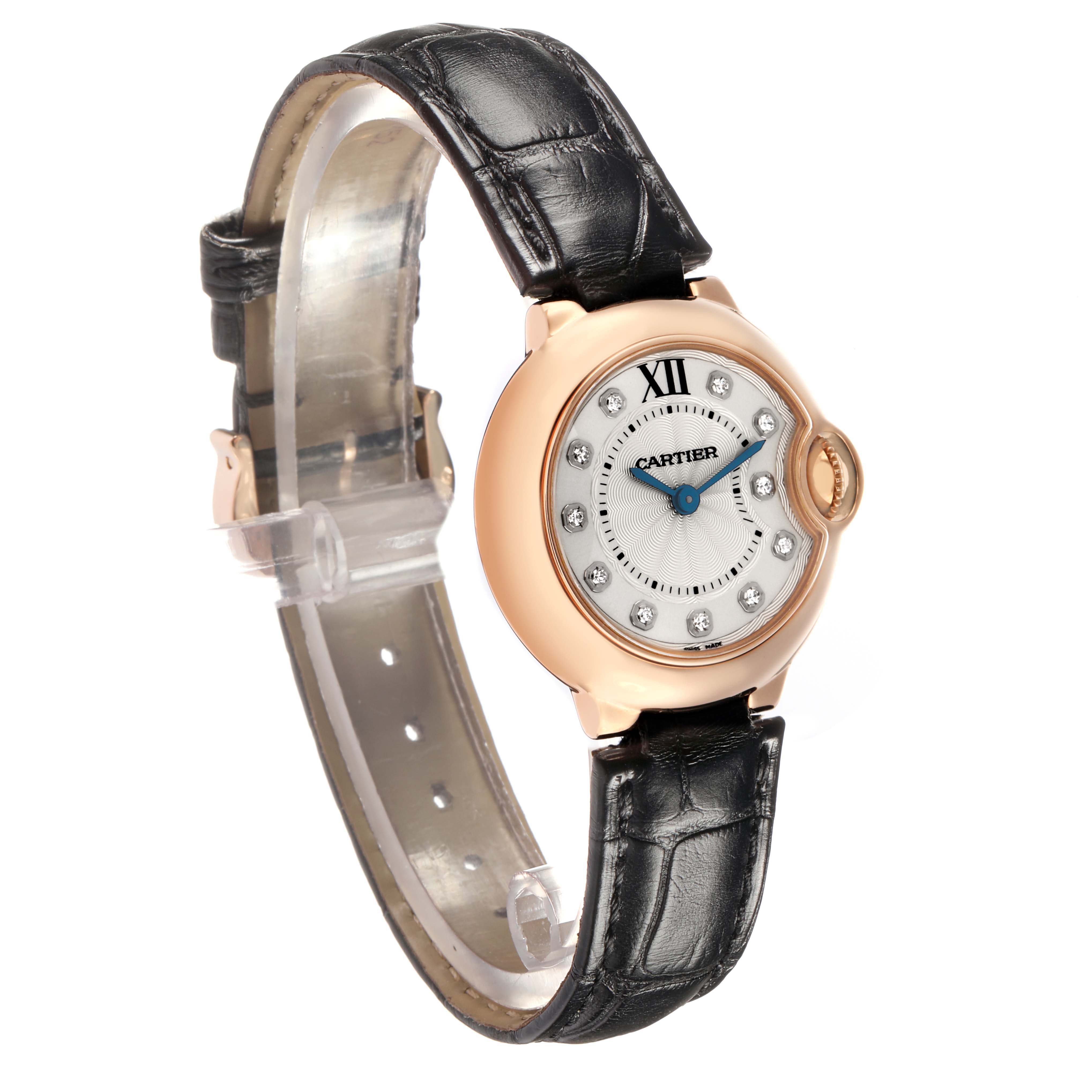The Cartier Ballon Bleu W6900256 Women
s Rose Gold Silver Dial watch is shown at an angled side view, displaying the watch face, crown, and leather strap.