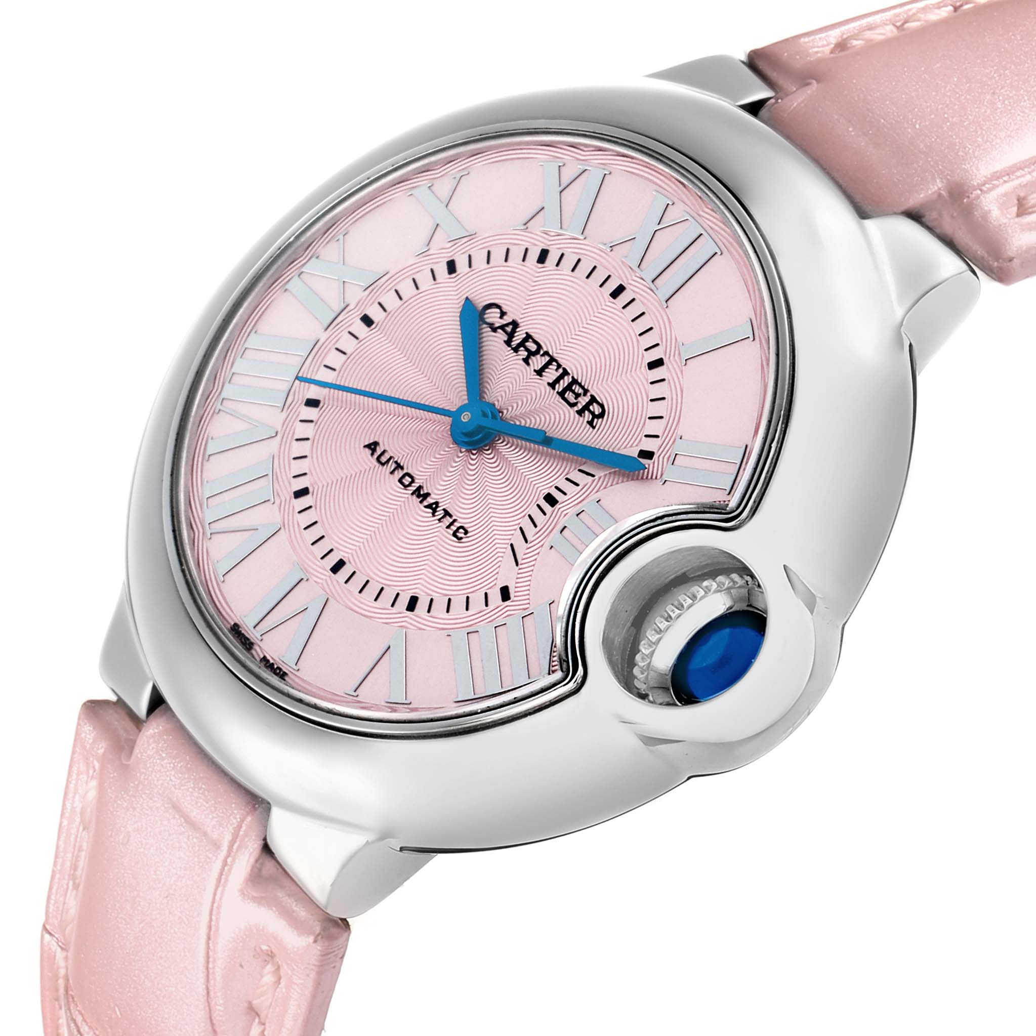 The Cartier Ballon Bleu WSBB0002 Women's Stainless Steel Pink Dial watch is shown at an angled close-up, highlighting its pink dial, blue hands, and crown.
