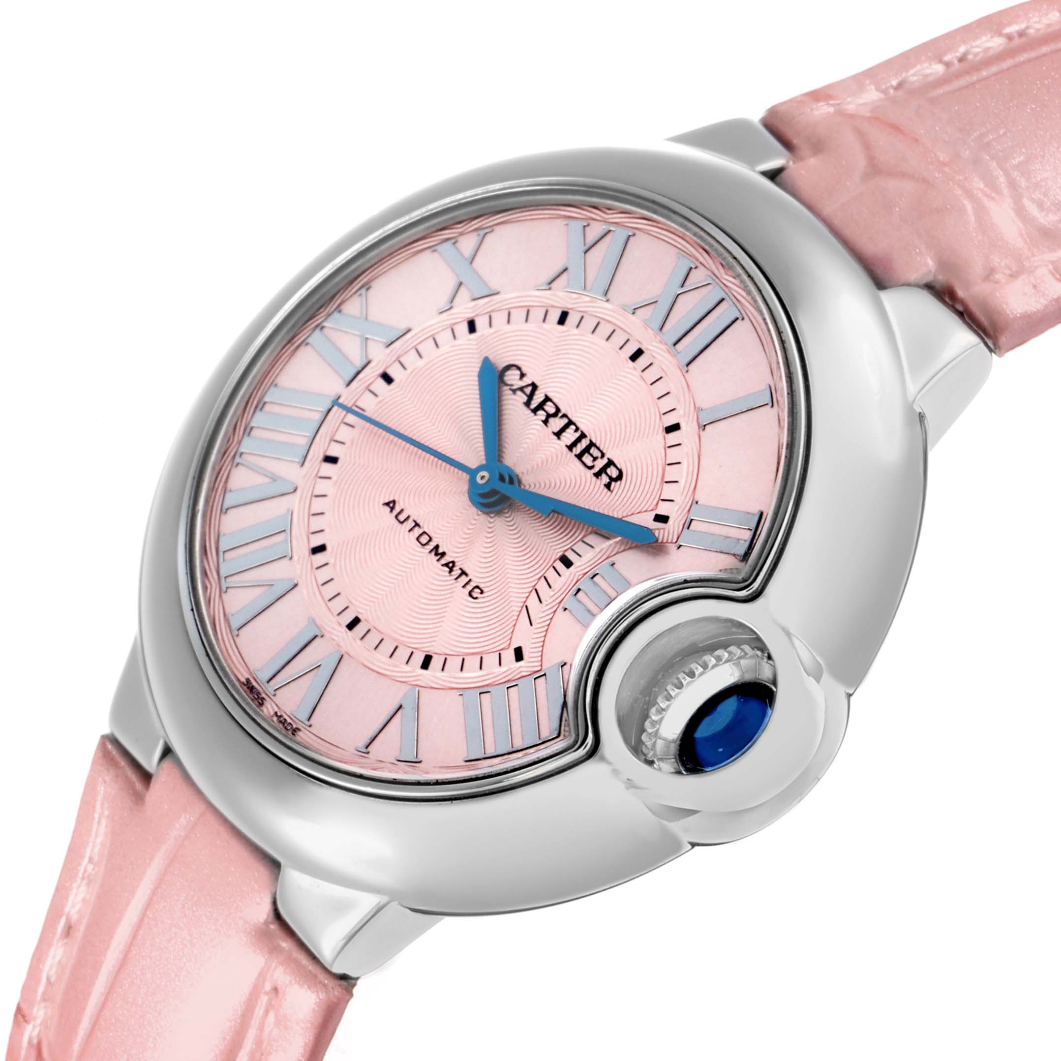 The Cartier Ballon Bleu WSBB0002 Women's Stainless Steel Pink Dial watch is angled slightly, showcasing the pink dial, Roman numerals, blue hands, and crown with a blue cabochon.