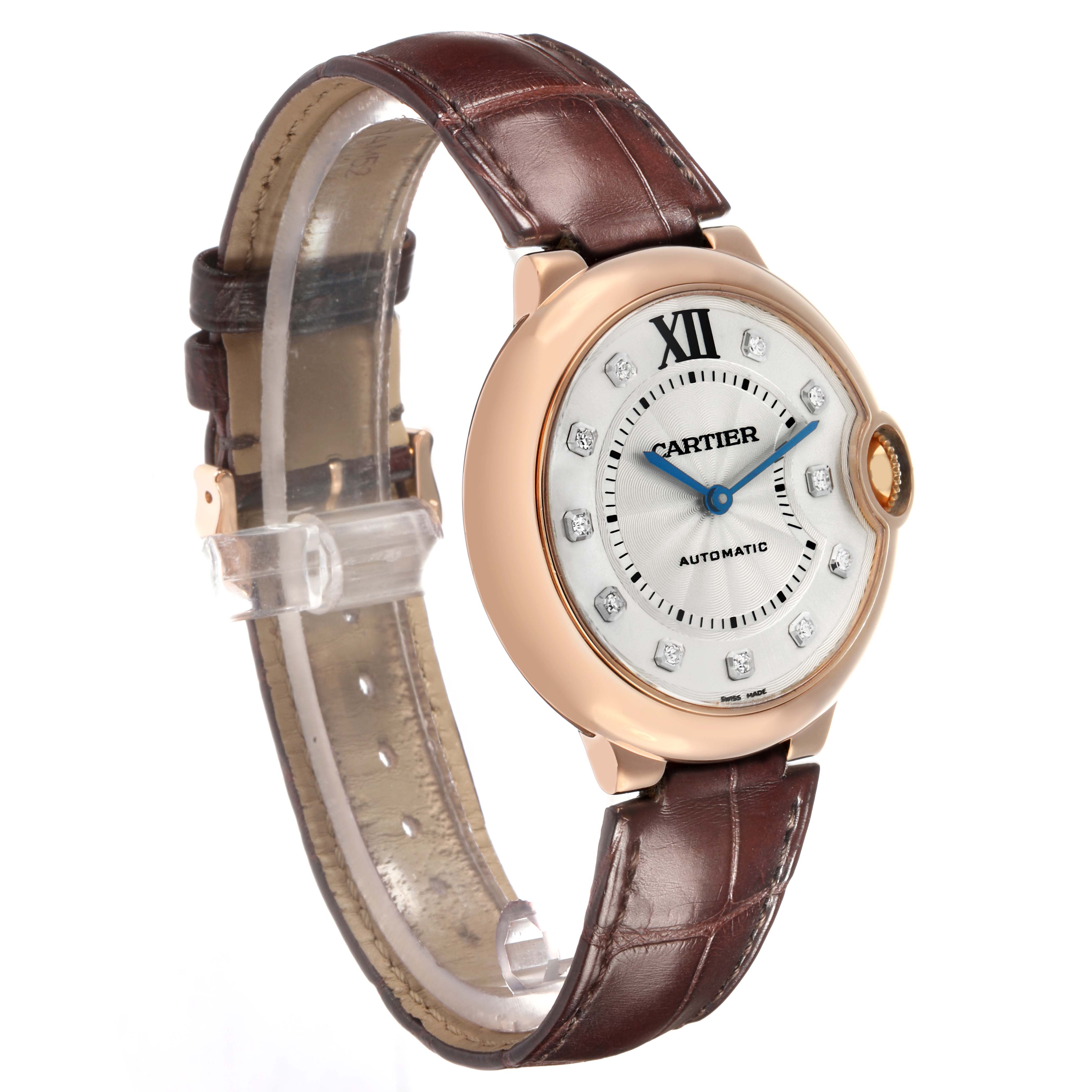 The Cartier Ballon Bleu WE902026 Women
s Rose Gold Silver Dial watch is shown at a slight angle, displaying the dial, case, and brown leather strap.