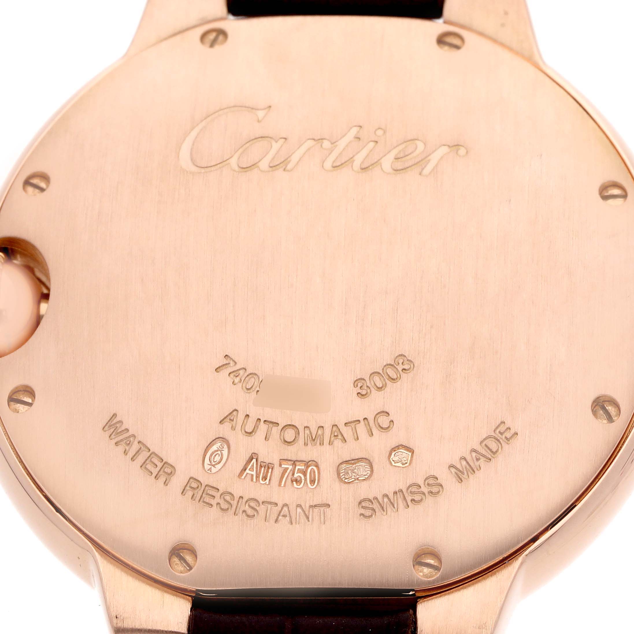 The image shows the back case of a Cartier Ballon Bleu WE902026 Women
s Rose Gold Silver Dial watch, highlighting engravings and the strap connection.