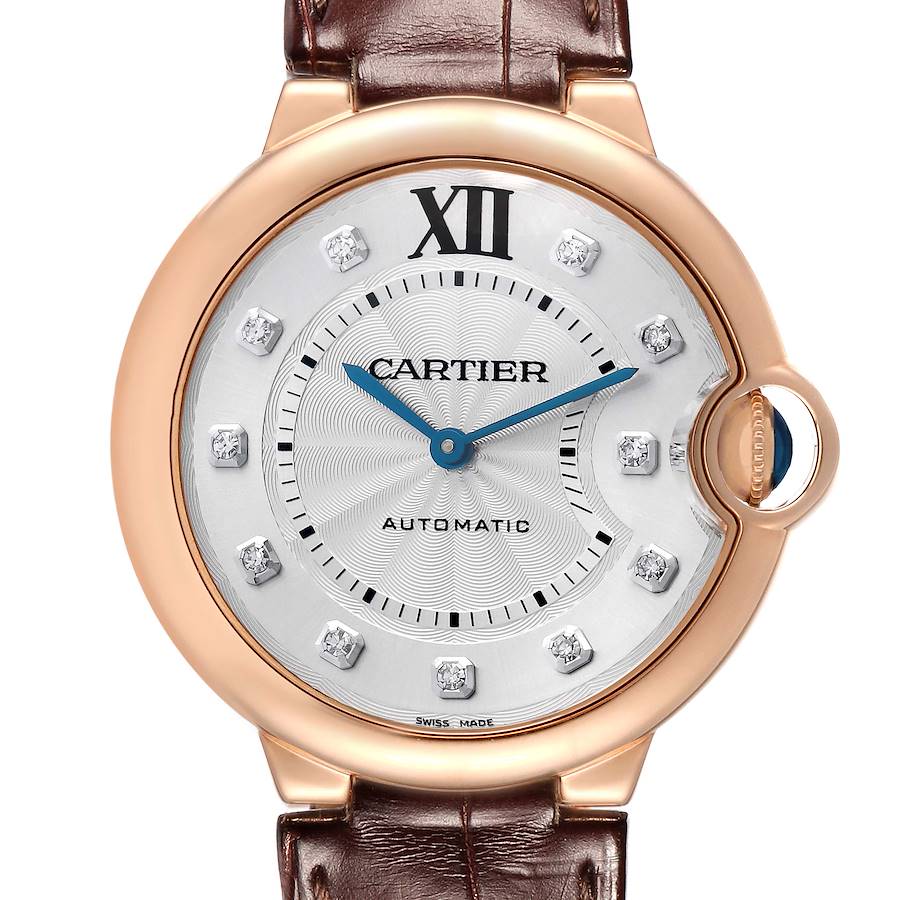 The Cartier Ballon Bleu WE902026 Women's Rose Gold Silver Dial watch is shown from the front, highlighting its dial, crown, and part of the leather strap.