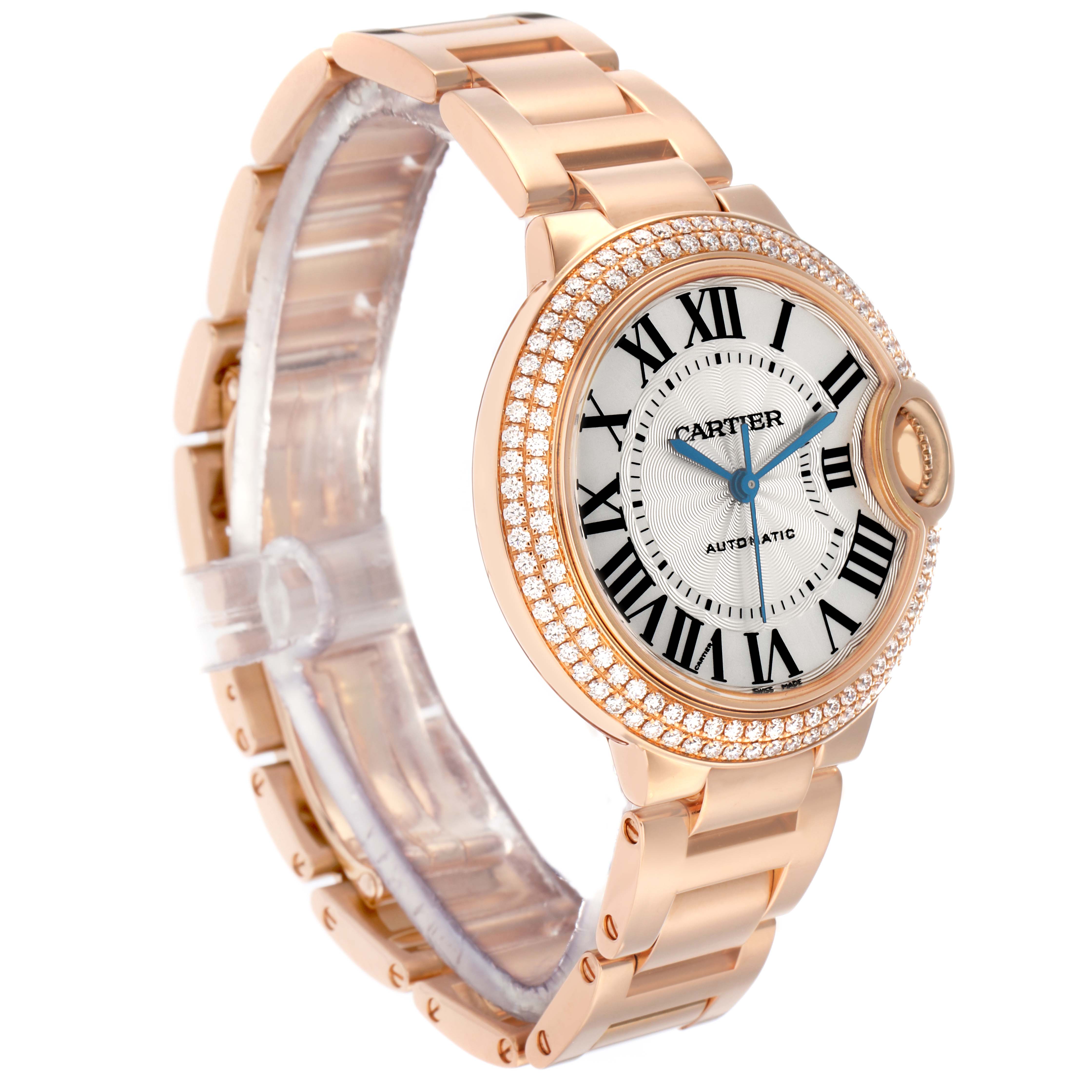 The Cartier Ballon Bleu WJBB0036 Women's Rose Gold Silver Dial watch is shown at a three-quarter angle, highlighting its face, strap, and diamond-studded bezel.