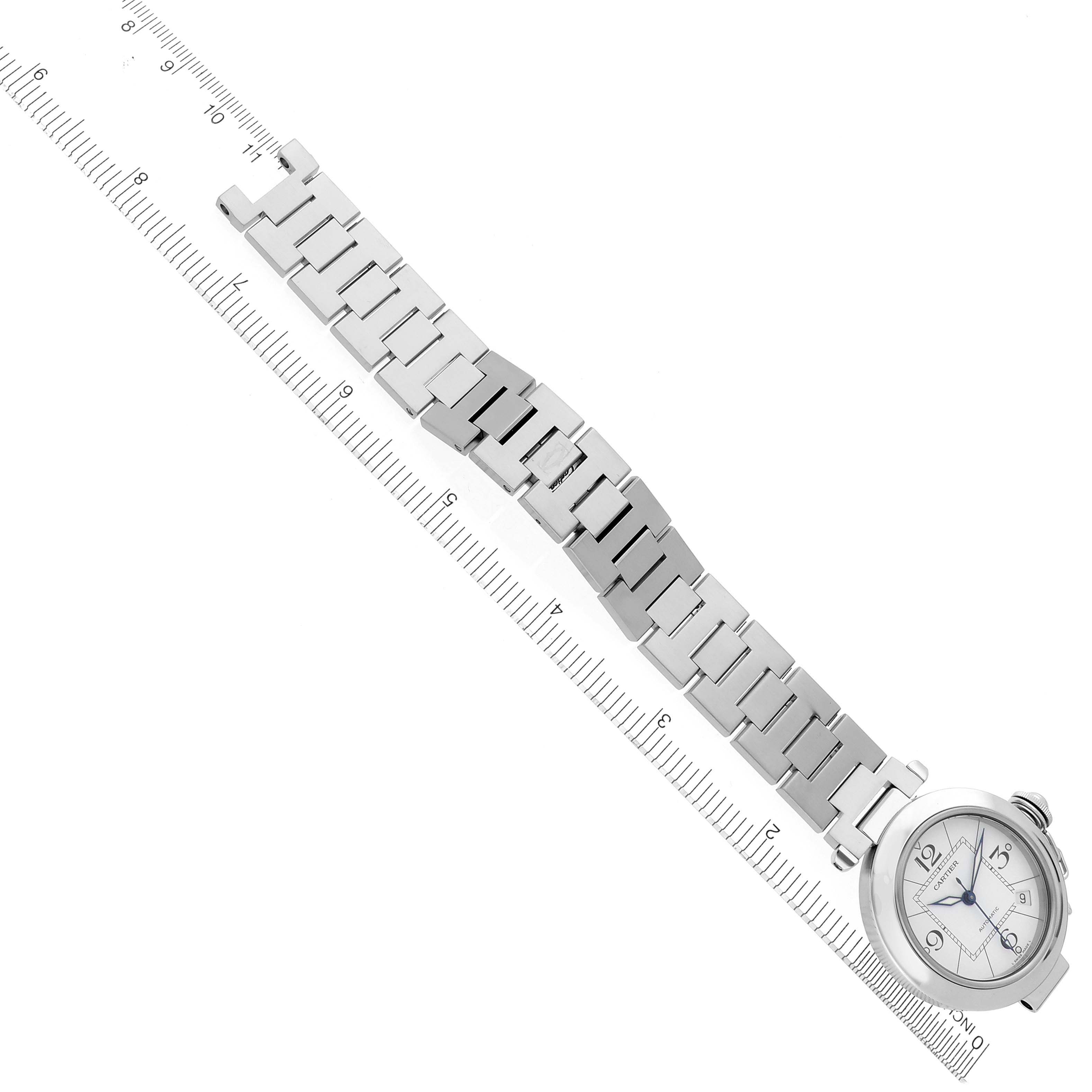 The Cartier Pasha W31074M7 Men's Stainless Steel White Dial W31074M7 Men's Stainless Steel White Dial watch is shown from a top-down angle, displaying the face and metal bracelet.