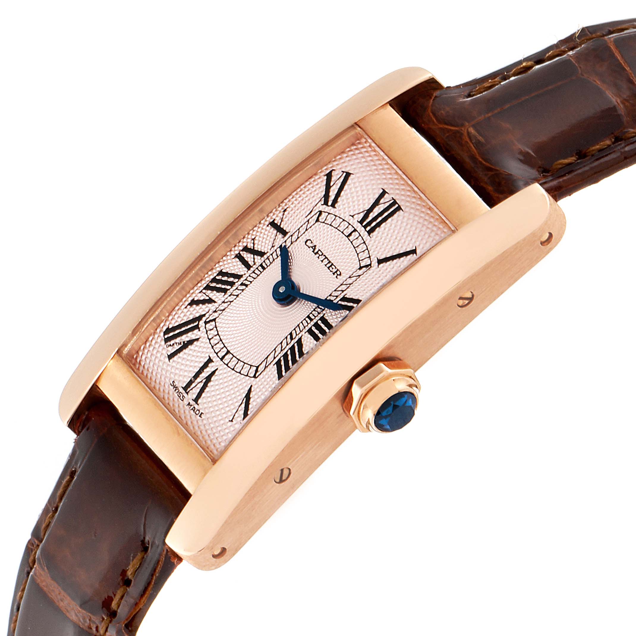 The image shows a side angle of the Cartier Tank Americaine 2597 Women's Rose Gold Pink Dial 2597 Women's Rose Gold Pink Dial watch displaying its face, case, crown, and leather strap.