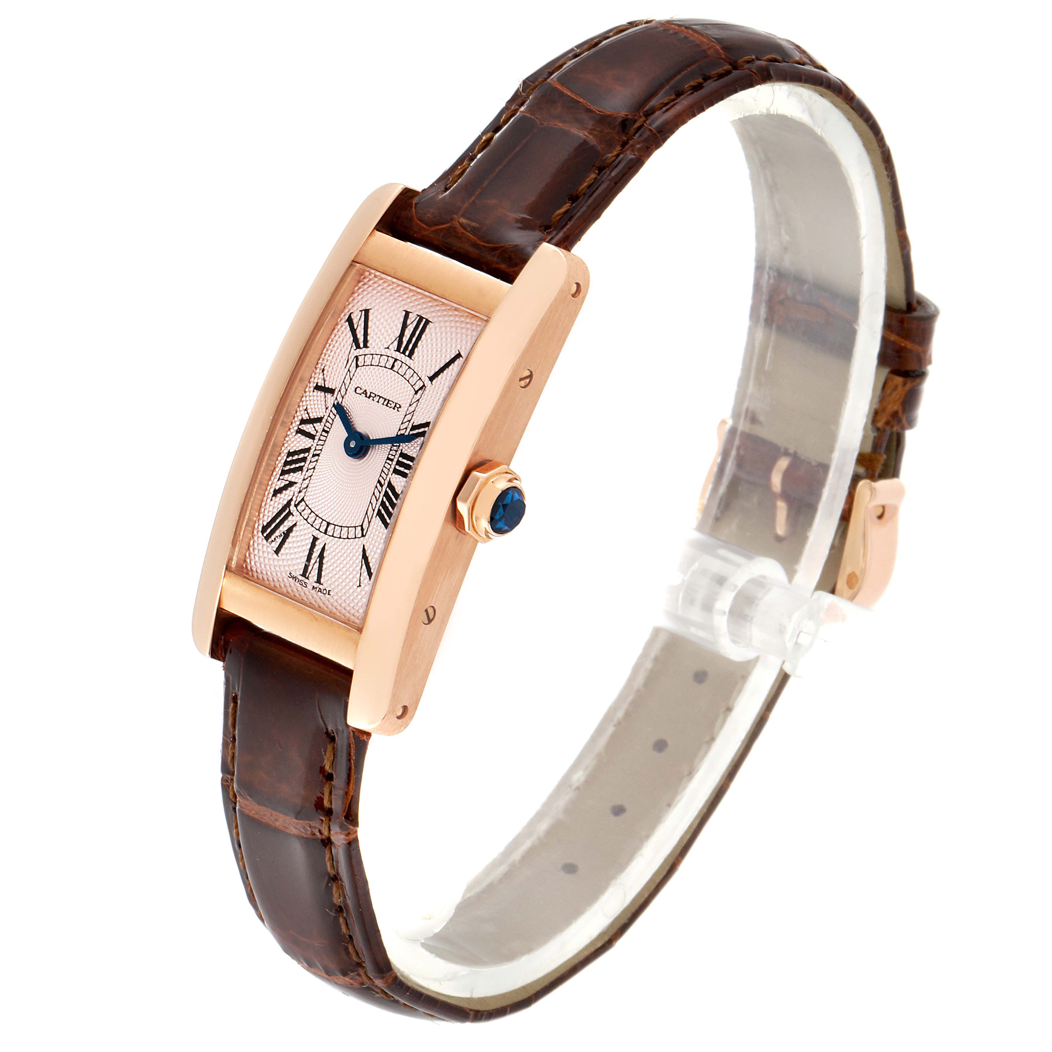 The image shows a Cartier Tank Americaine 2597 Women's Rose Gold Pink Dial 2597 Women's Rose Gold Pink Dial watch at an angled view, displaying its face, leather strap, and crown.