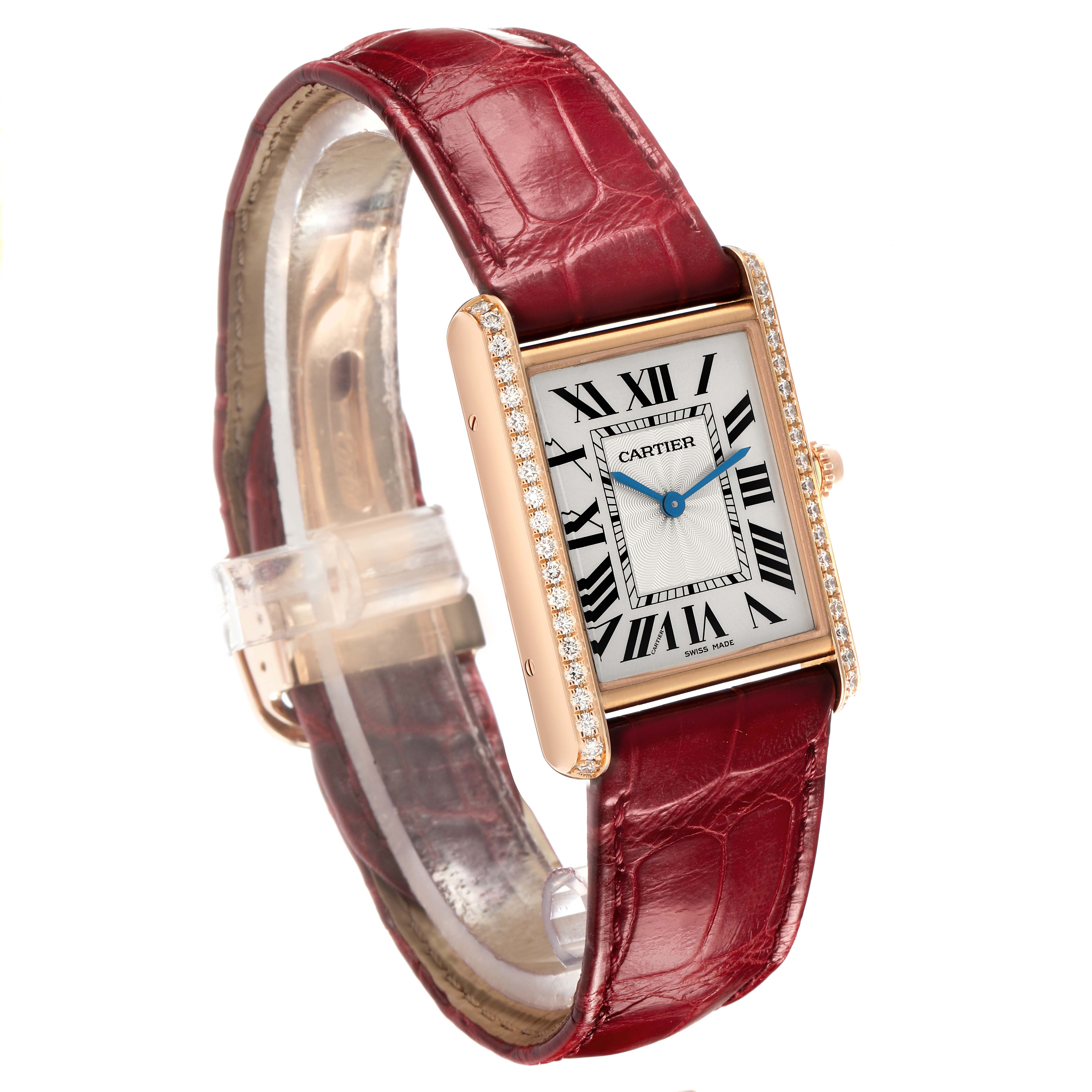 The Cartier Tank Louis WJTA0014 Women's Rose Gold Silver Dial watch is shown at a slight angle, highlighting its rectangular face, diamond bezel, and red leather strap.