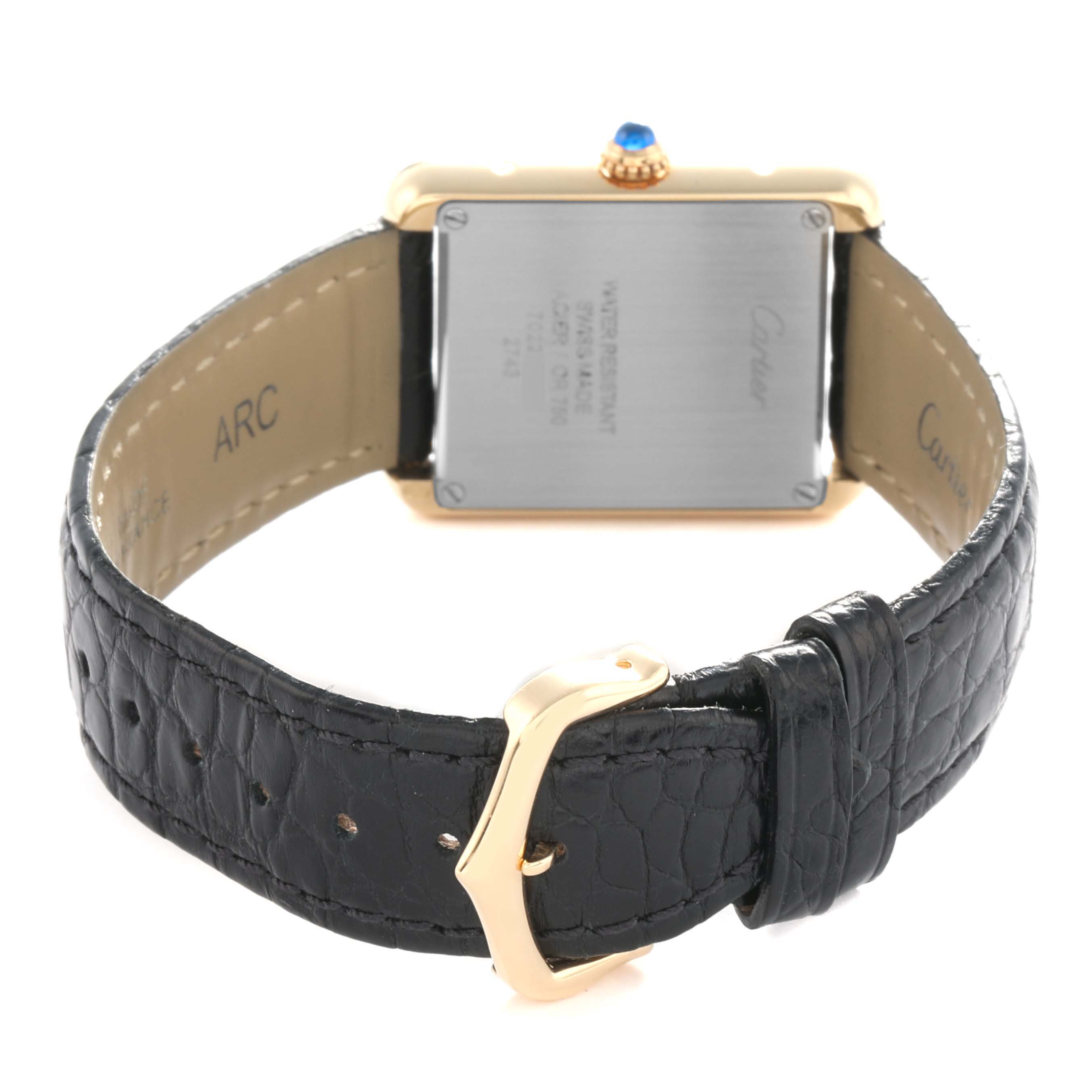 The image shows the back case and leather strap of a Cartier Tank Solo W1018755 Women's Steel and Gold (two tone) Silver Dial watch, highlighting the clasp and case back details.