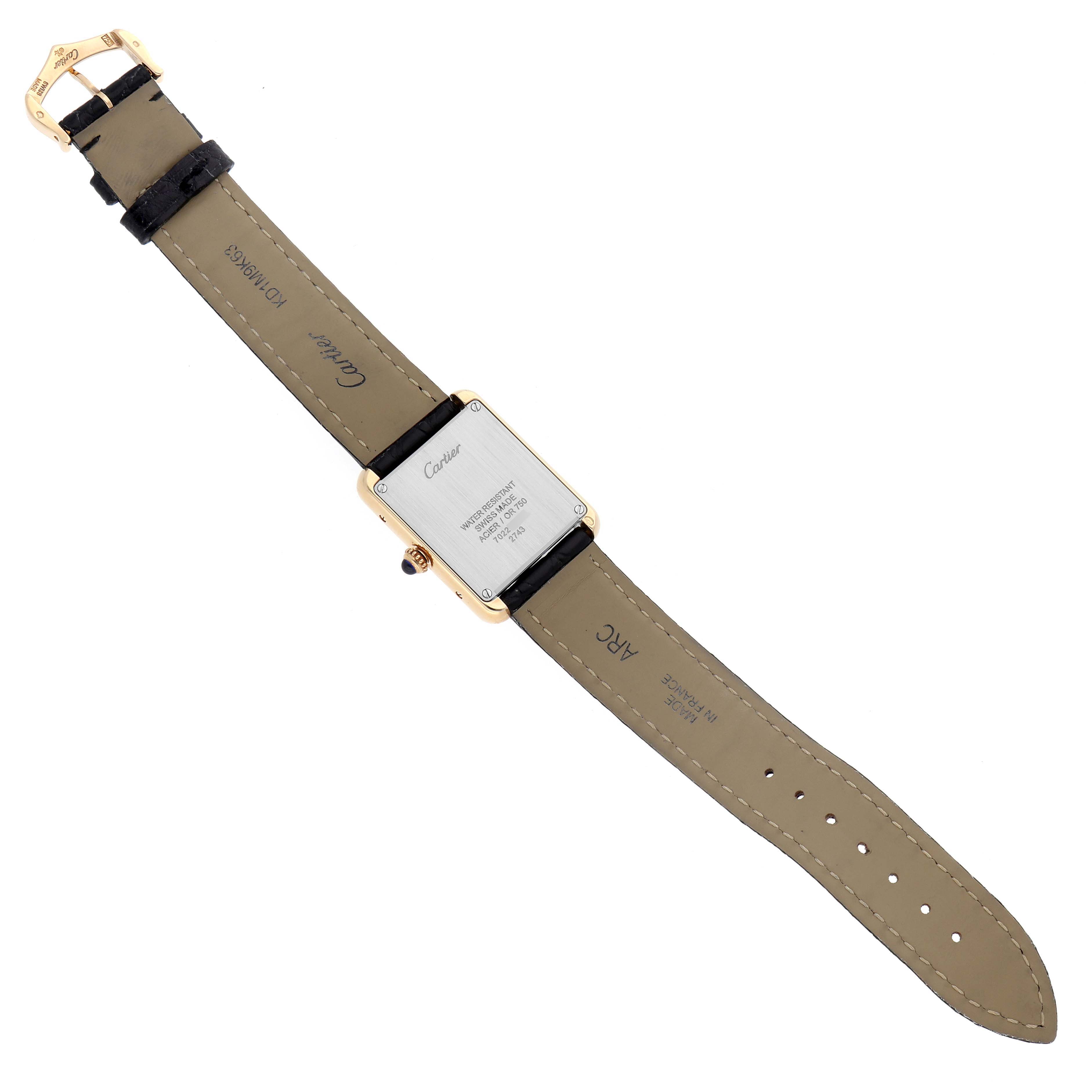 The image shows the Cartier Tank Solo W1018755 Women's Steel and Gold (two tone) Silver Dial's back and strap in a flat lay view.