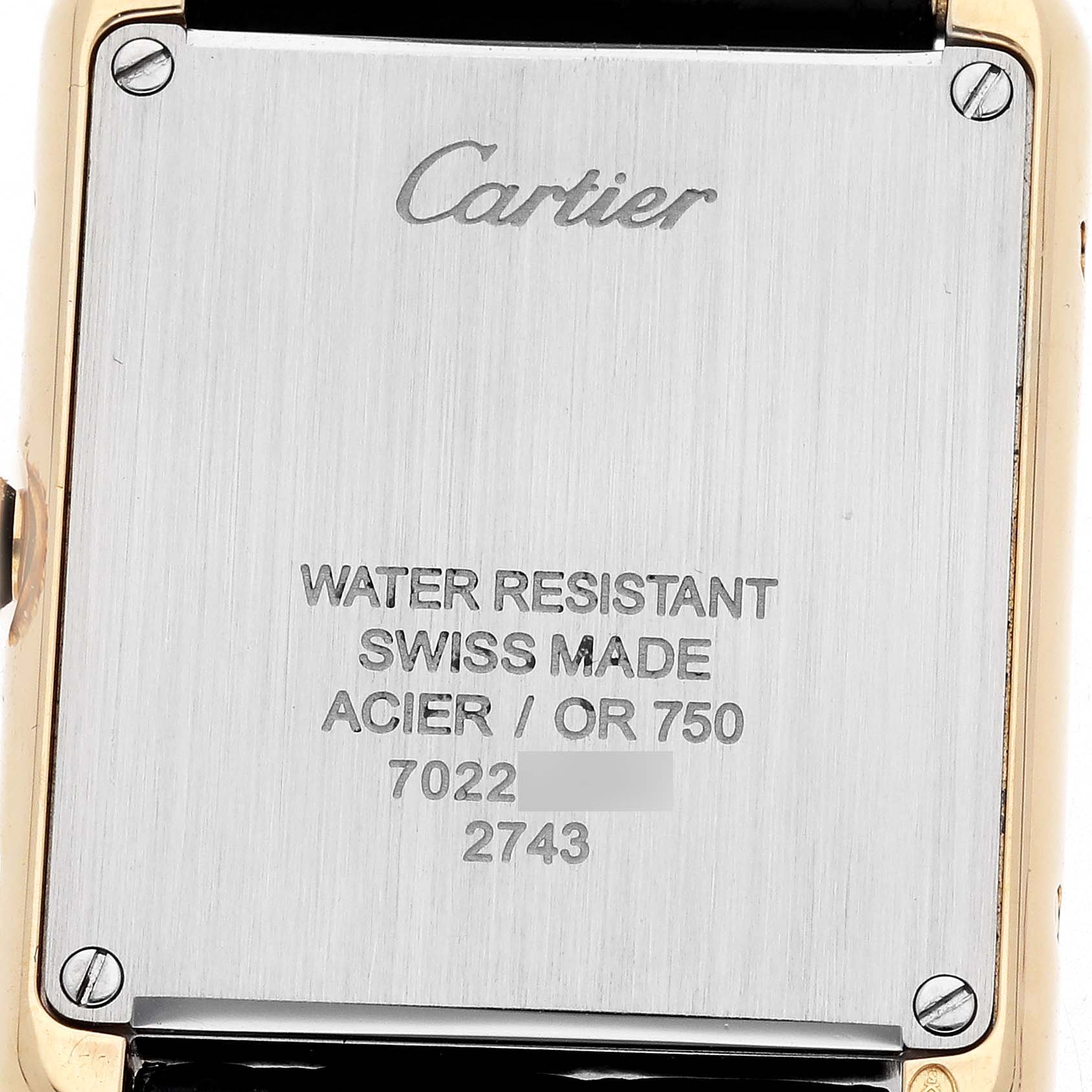 The image shows the back case of a Cartier Tank Solo W1018755 Women's Steel and Gold (two tone) Silver Dial model, highlighting its water resistance and Swiss made details.