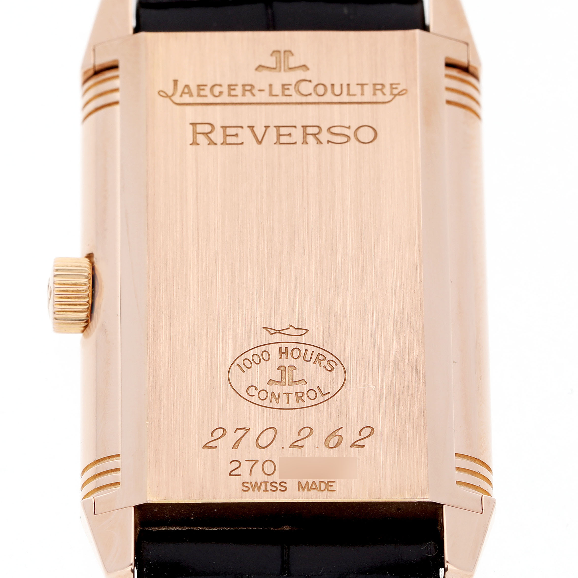 The image shows the back of the Jaeger-LeCoultre Reverso watch, with its crown visible on the side.