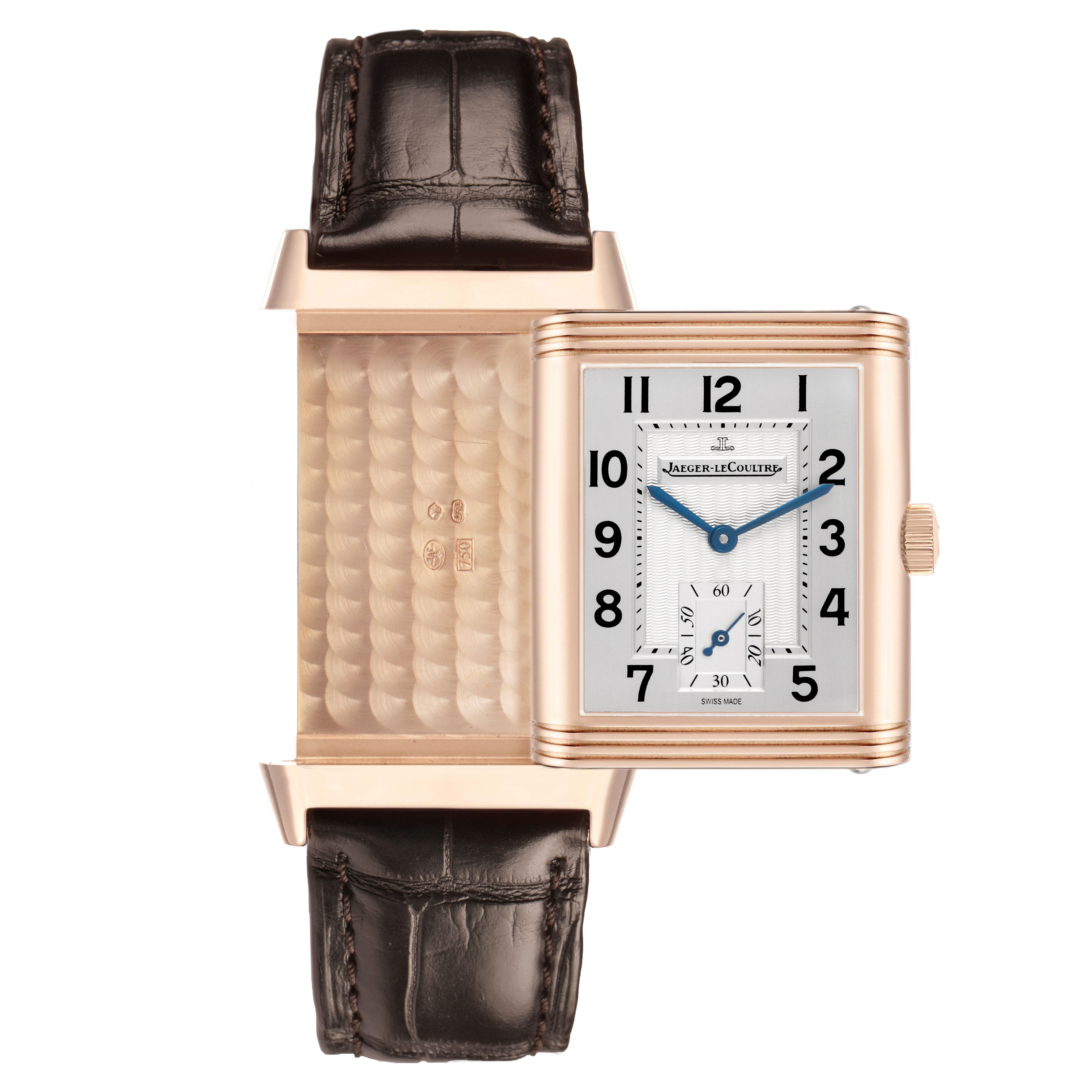 The image shows a Jaeger-LeCoultre Reverso watch with its swiveling case open, revealing both the watch face and the engraved reverse.