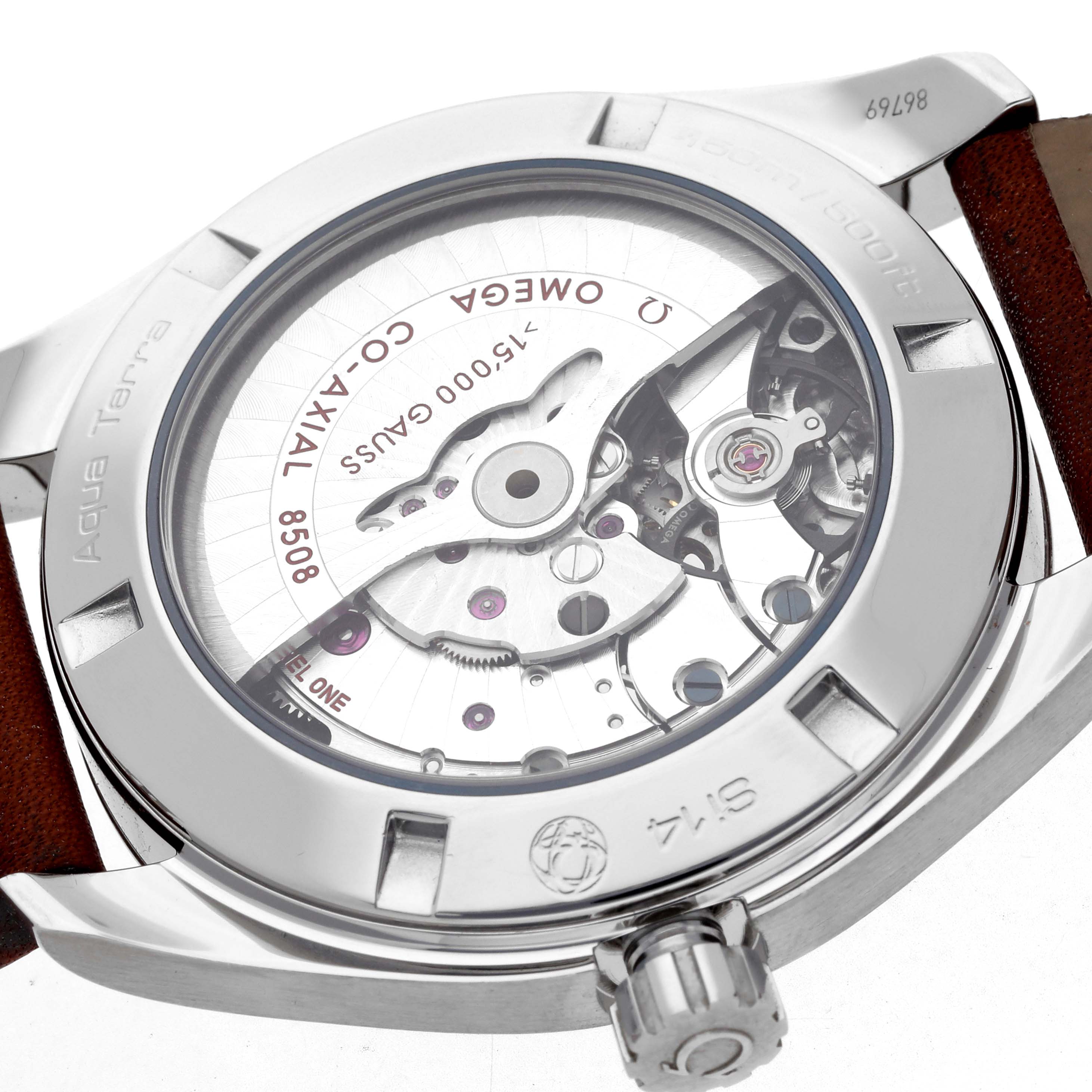 The image shows the back of the Omega Aqua Terra 231.12.42.21.01.001 Men
s Stainless Steel Black Dial watch, highlighting the movement and Co-Axial mechanism.