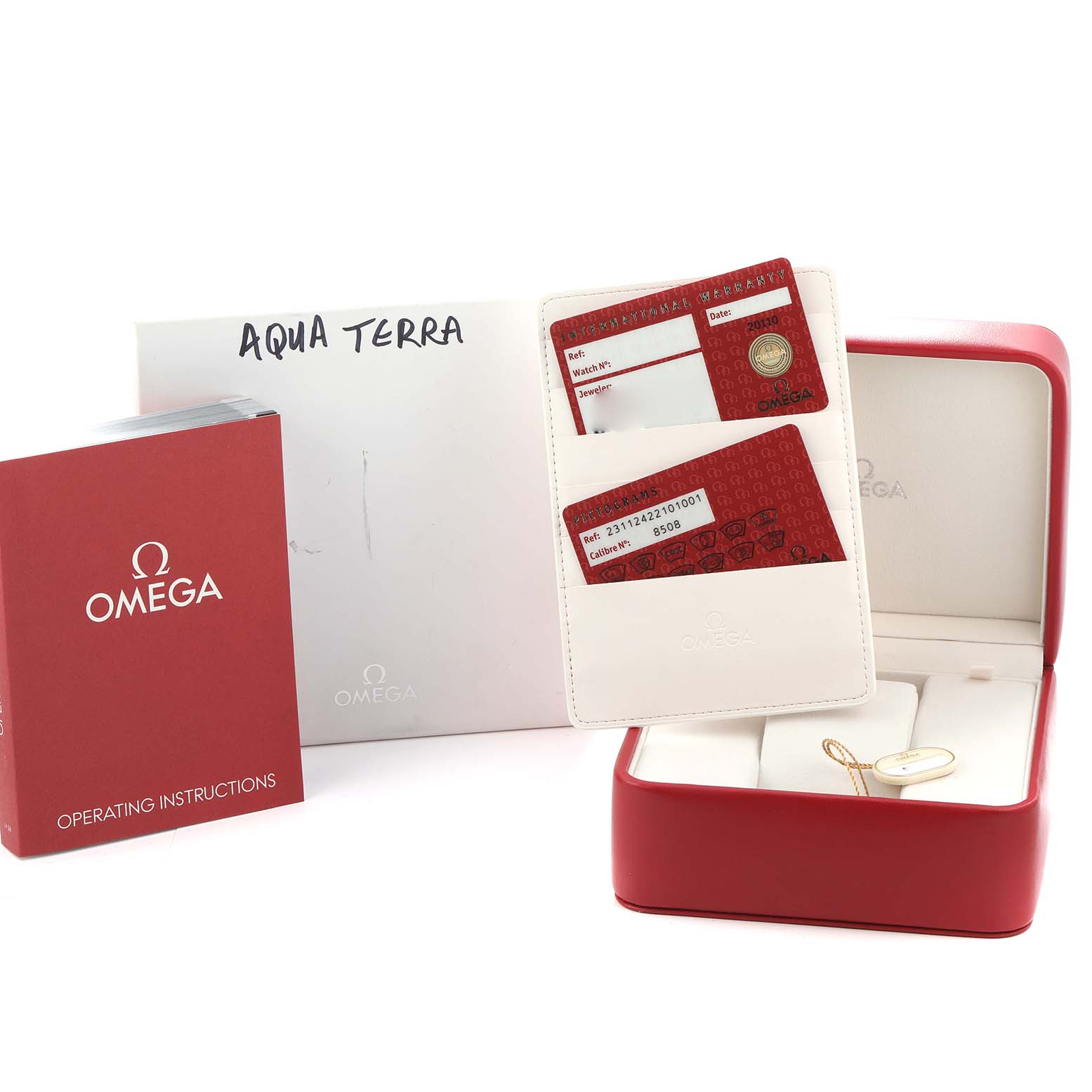 The image shows the Omega Aqua Terra 231.12.42.21.01.001 Men
s Stainless Steel Black Dial model
s accessories, including the operating instructions, warranty cards, and a presentation box.