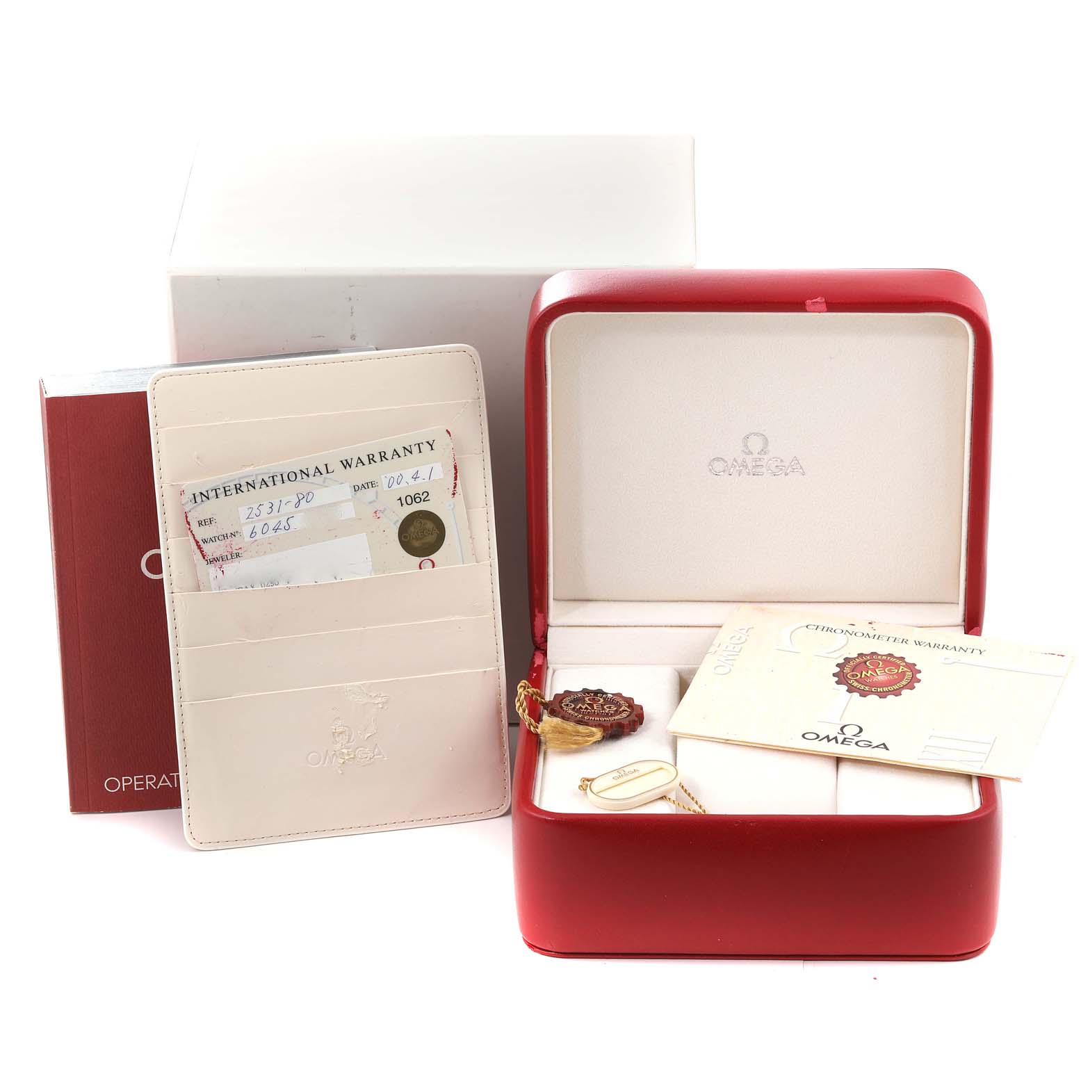 The image shows the packaging, warranty card, and accessories for an Omega Seamaster 2531.80.00 Men's Stainless Steel Blue Dial 2531.80.00 Men's Stainless Steel Blue Dial model watch.