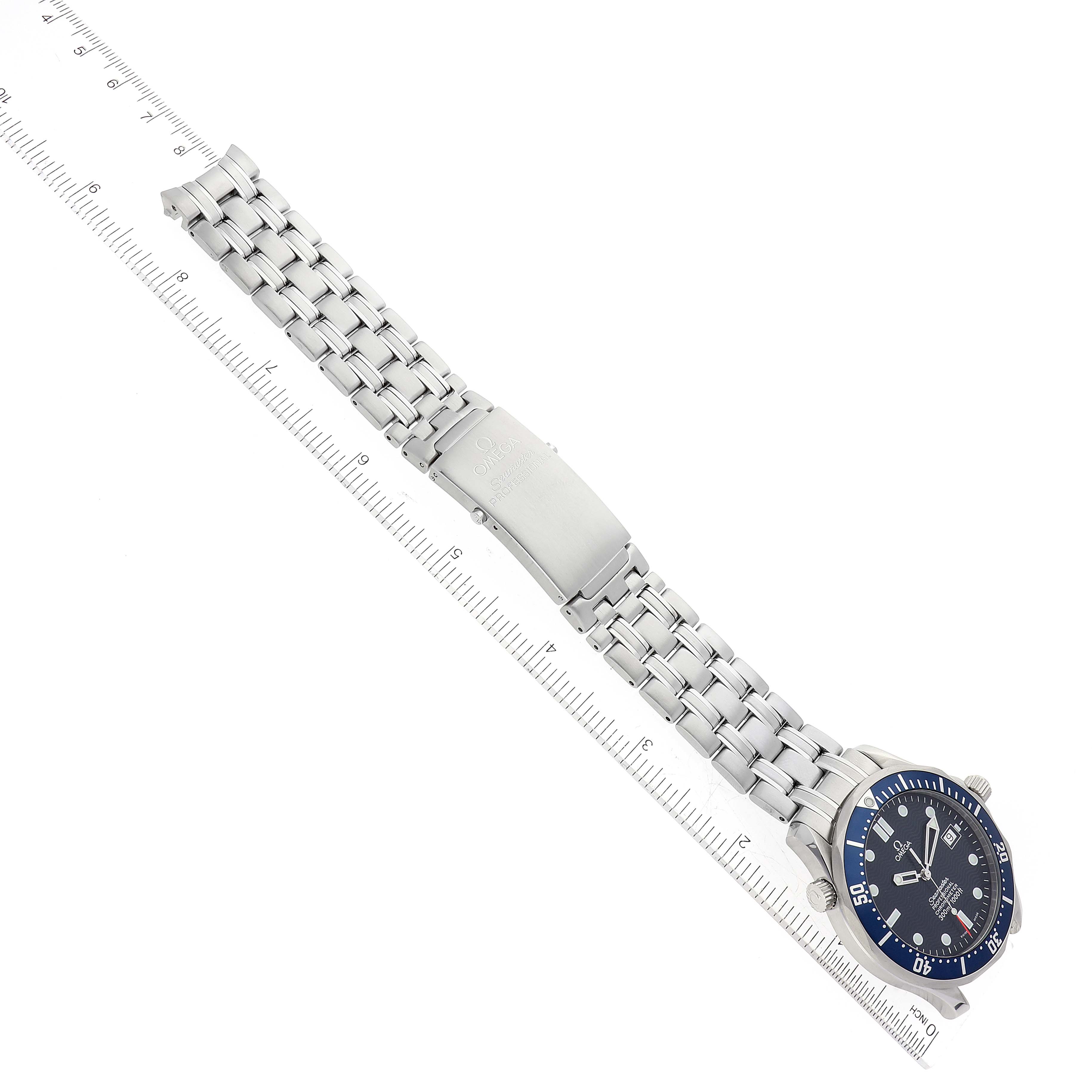 The image shows an Omega Seamaster 2531.80.00 Men's Stainless Steel Blue Dial 2531.80.00 Men's Stainless Steel Blue Dial model watch, photographed from an overhead angle, highlighting the face and full metal bracelet with a ruler for scale.