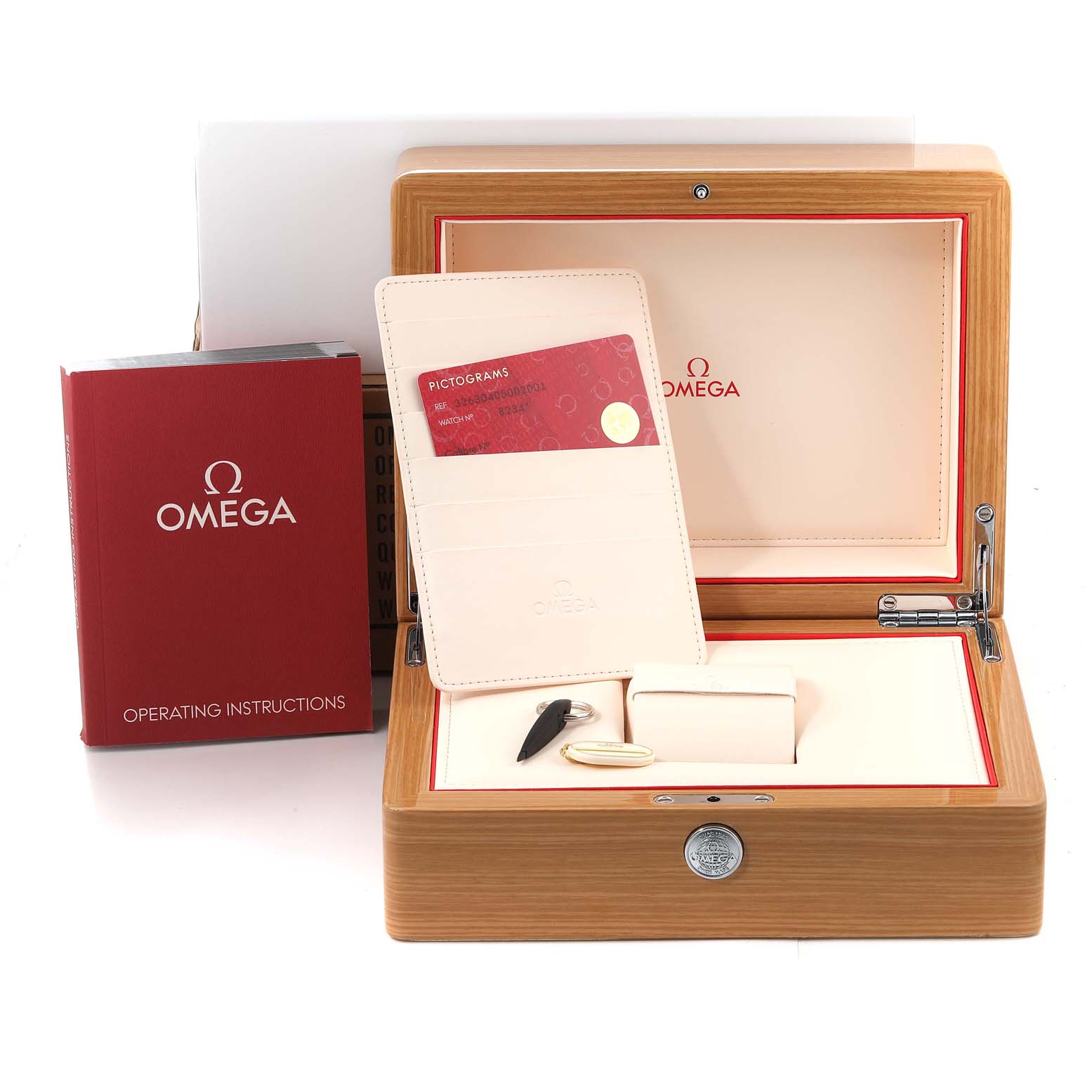 The image shows the packaging and accessories for the Omega Speedmaster 326.30.40.50.02.001 Men
s Stainless Steel Silver Dial 326.30.40.50.02.001 Men
s Stainless Steel Silver Dial watch, including a wood box, a cardholder, a tool, and an instruction manual.