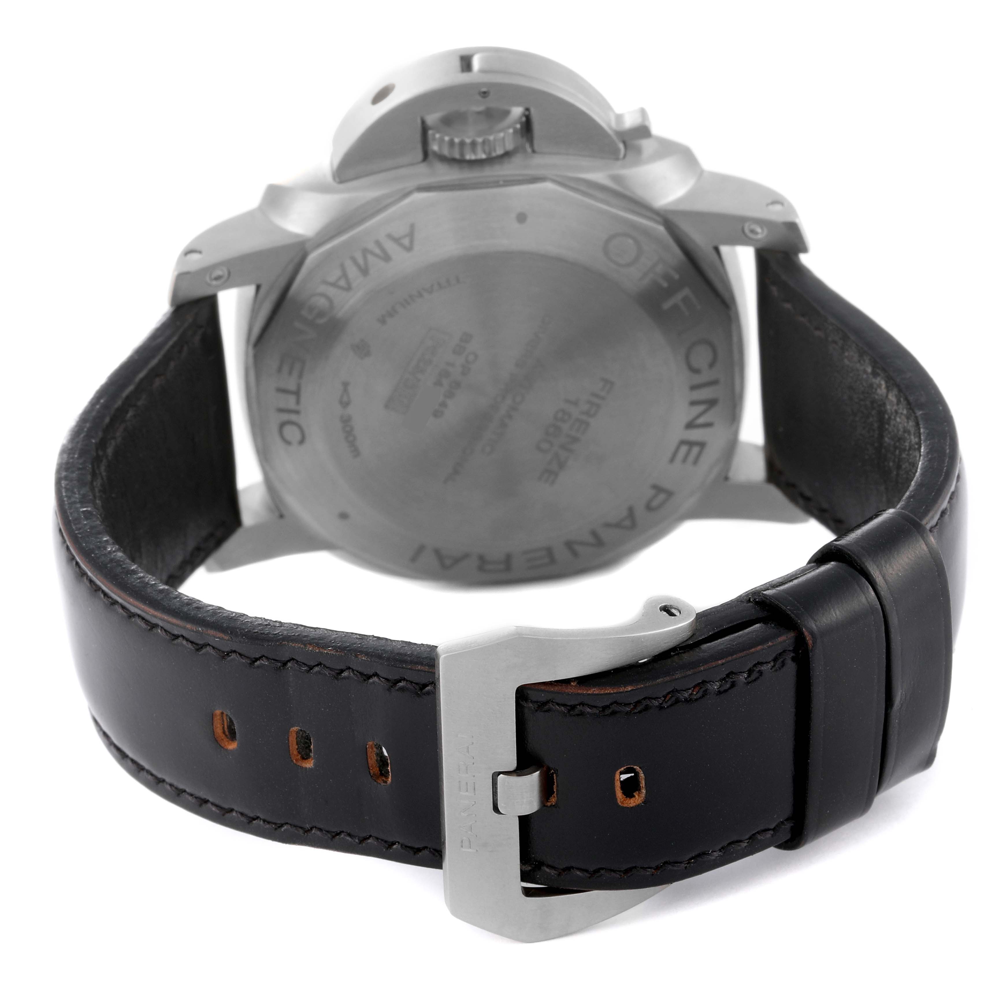 The image shows the back view of a Panerai Submersible PAM00389 Men
s Titanium Black Dial PAM00389 Men
s Titanium Black Dial watch, highlighting the case back and leather strap with buckle.