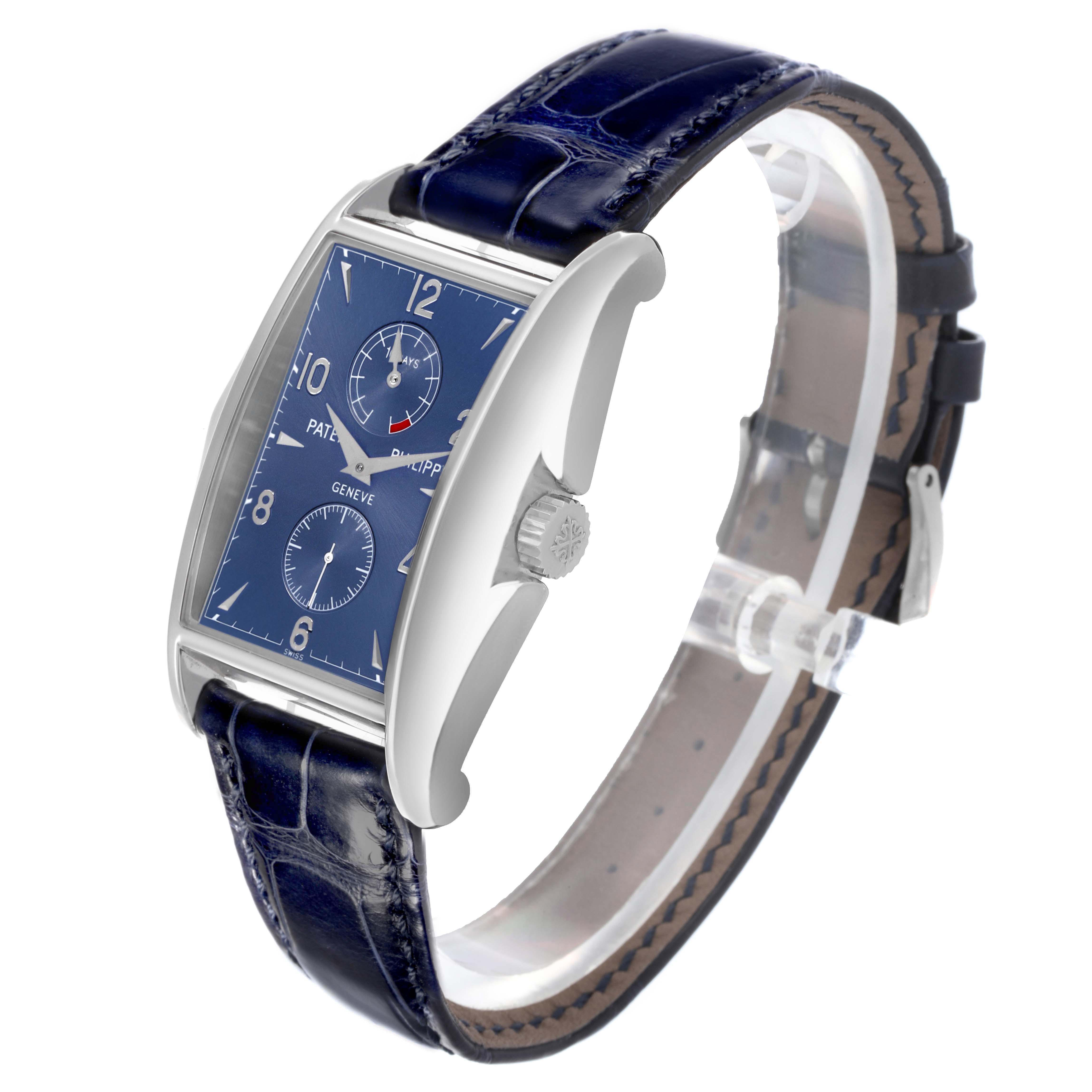 The Patek Philippe Gondolo 5100G - 001 Men's White Gold Blue Dial watch is shown at an angle displaying its blue dial, crown, and leather strap.