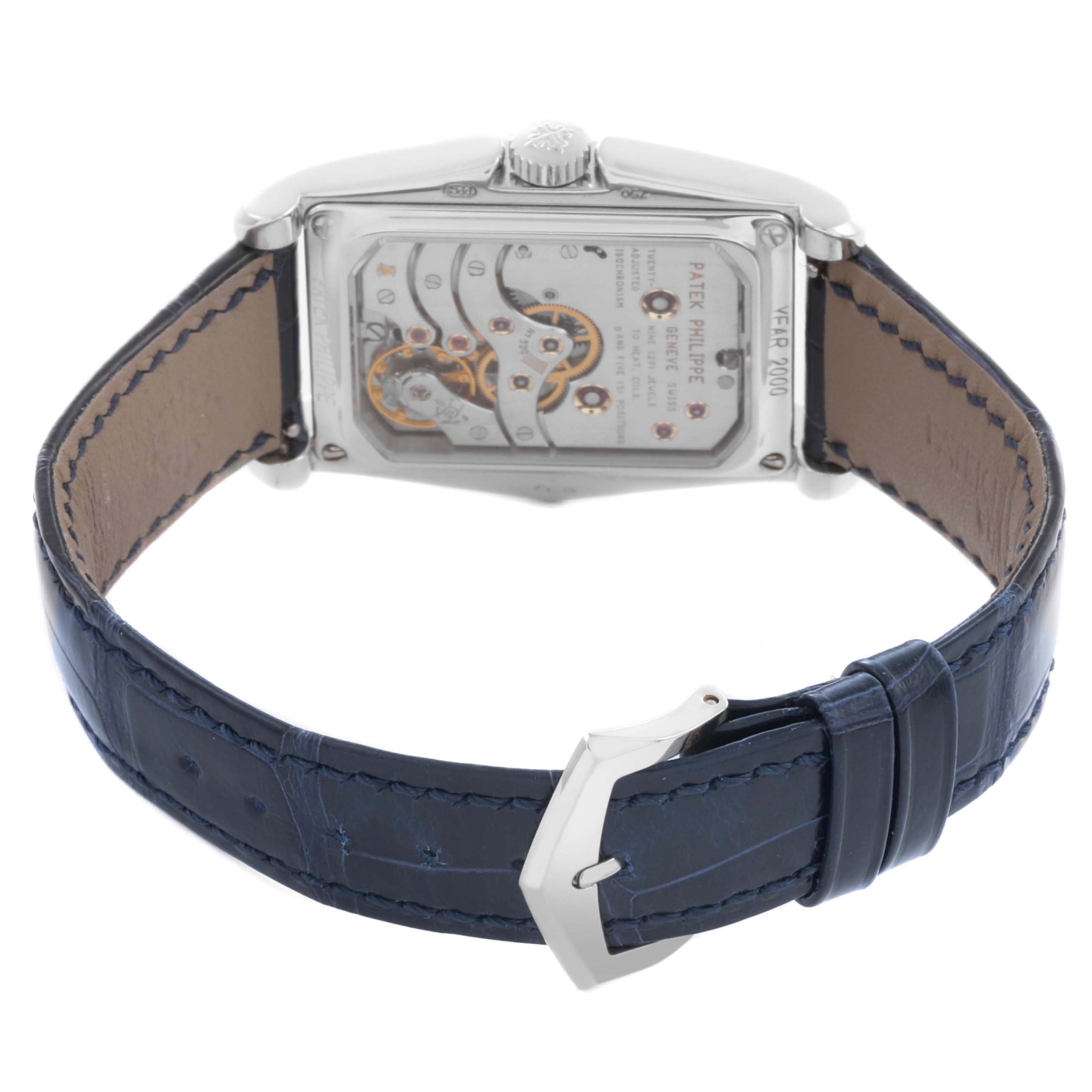 The image shows the back view of a Patek Philippe Gondolo 5100G - 001 Men's White Gold Blue Dial watch, highlighting its movement and leather strap.