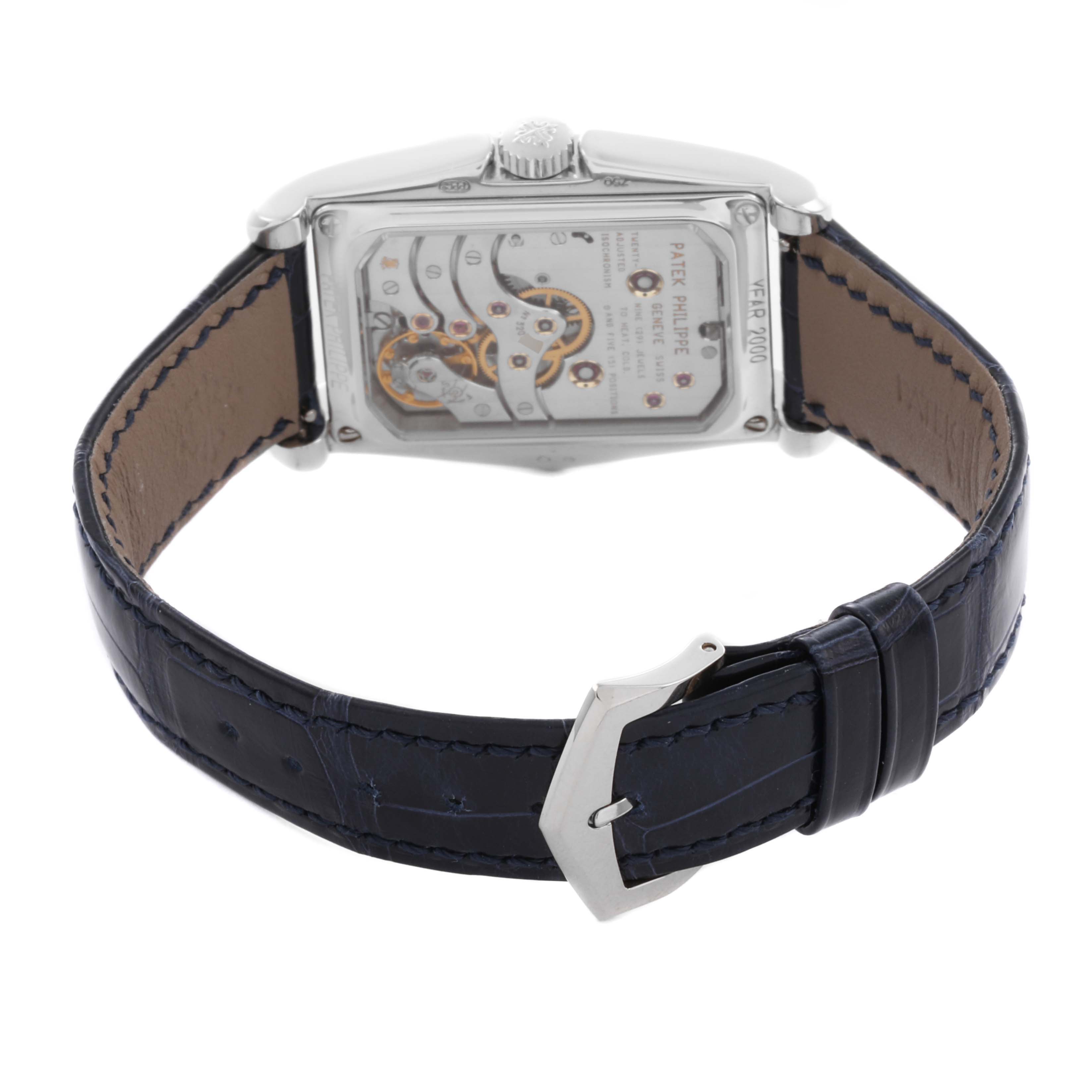 The Patek Philippe Gondolo 5100G - 001 Men's White Gold Blue Dial 5100G - 001 Men's White Gold Blue Dial watch is shown from the back, highlighting its movement and the blue leather strap with a buckle.