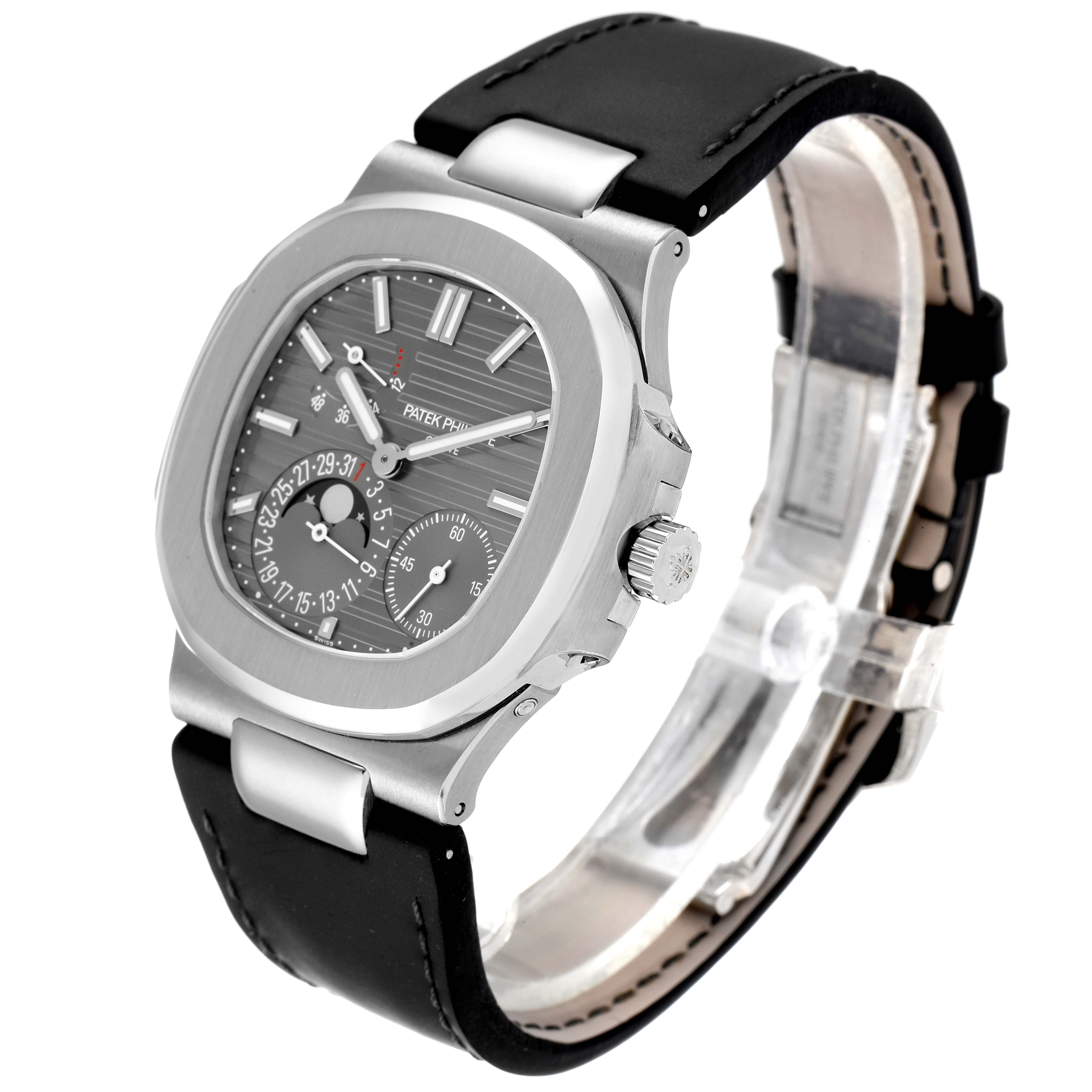 The image shows a Patek Philippe Nautilus 5712G/001 Men's White Gold Grey Dial 5712G/001 Men's White Gold Grey Dial watch at a three-quarter angle, highlighting the face, case, crown, and strap.