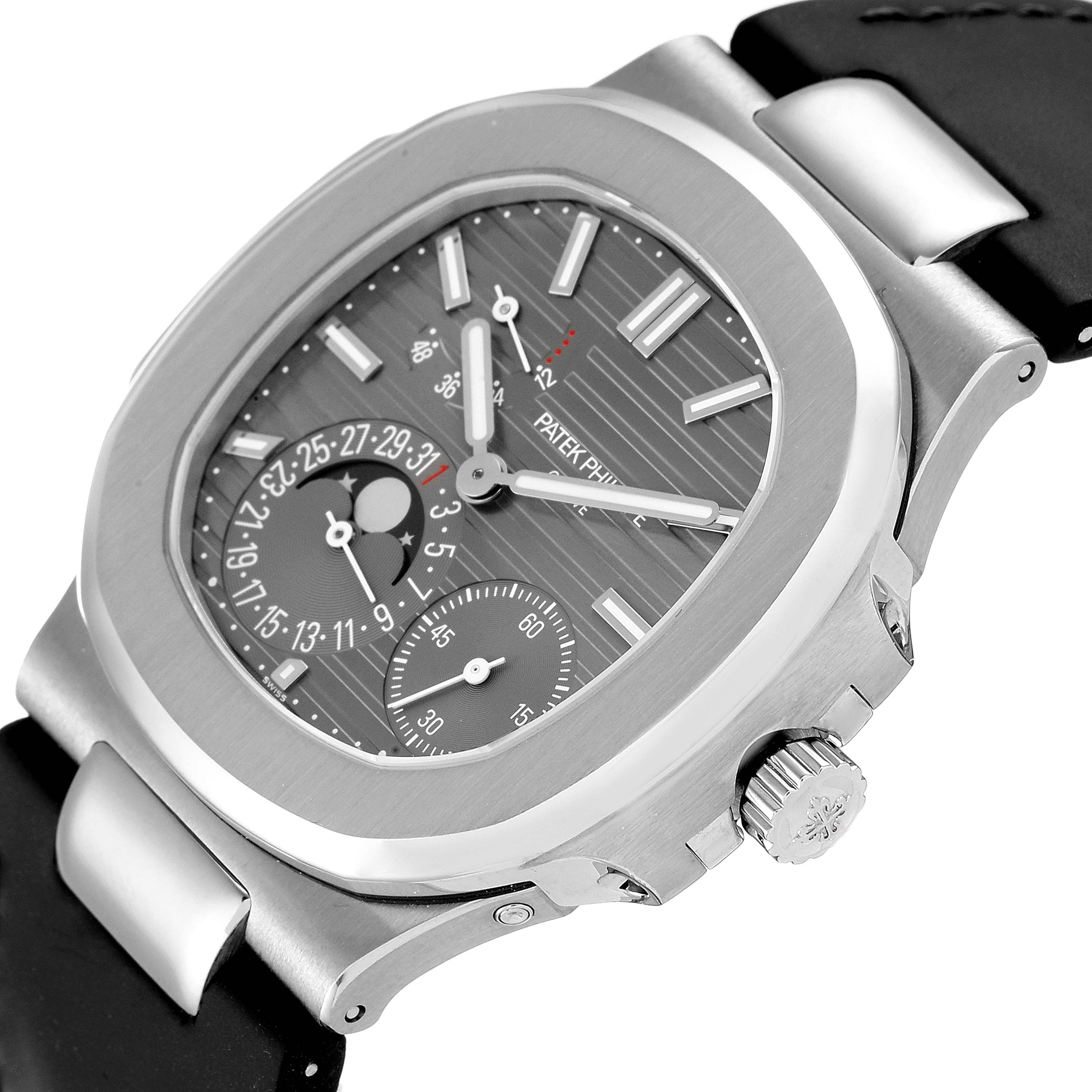 The image shows a close-up, side-angle view of the Patek Philippe Nautilus 5712G/001 Men's White Gold Grey Dial 5712G/001 Men's White Gold Grey Dial watch, highlighting the dial, bezel, crown, and part of the strap.