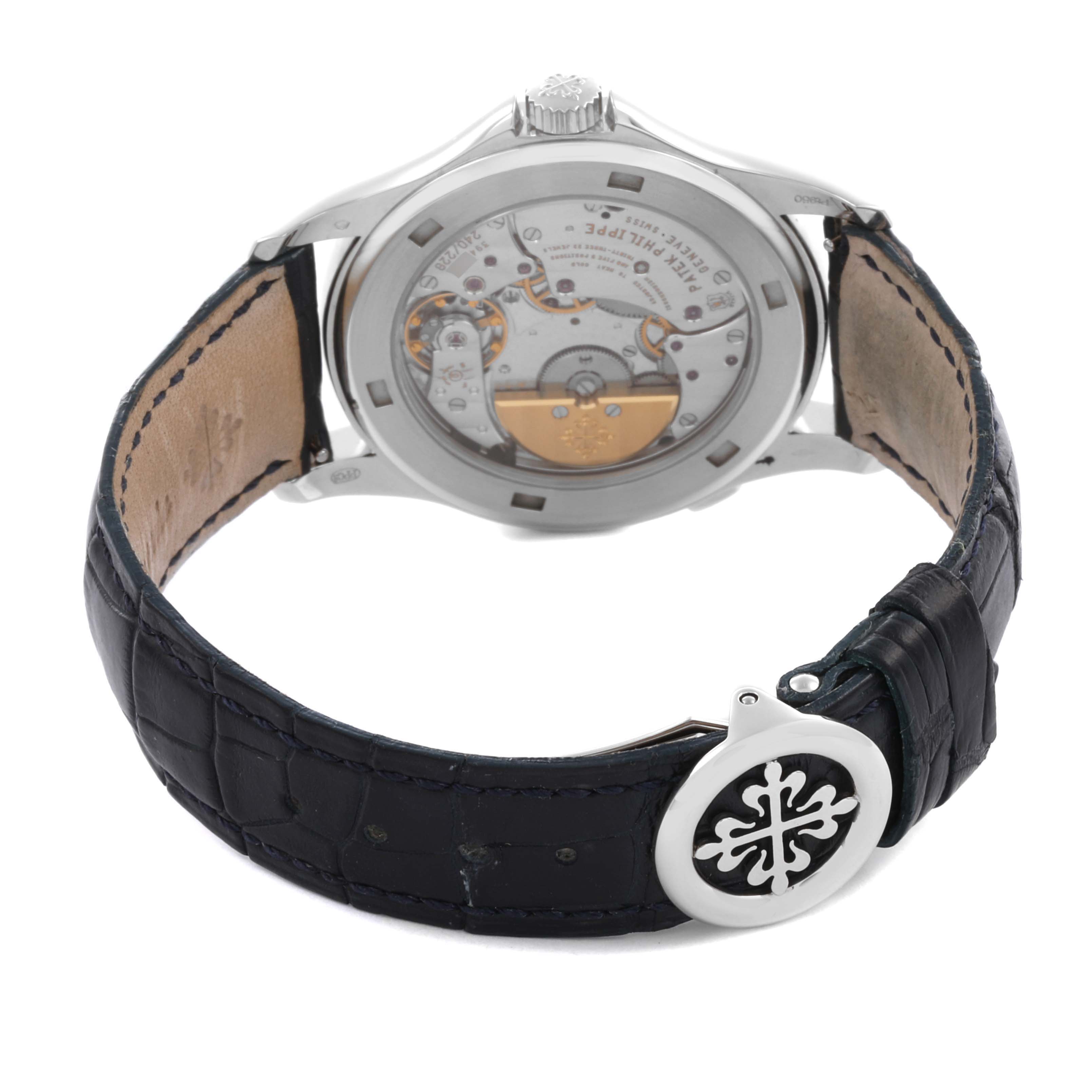 The Patek Philippe Complications 5130P-001 Men's Platinum Blue Dial 5130P-001 Men's Platinum Blue Dial watch is shown from the back, highlighting its transparent case back and leather strap.