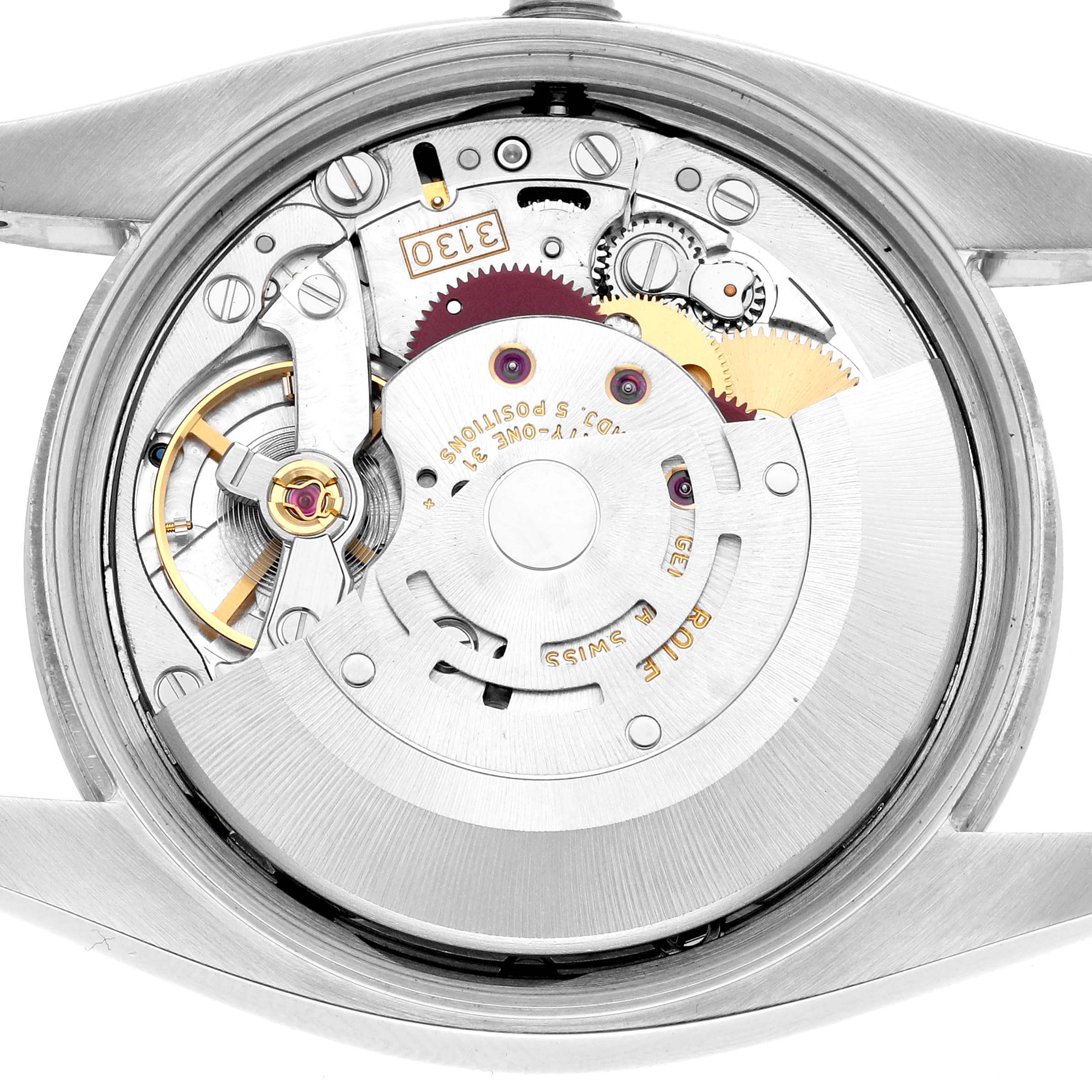 The image shows the internal mechanism of a Rolex Air-King 114200 Men
s Stainless Steel Blue Dial, highlighting gears and movement components from a top-down angle.