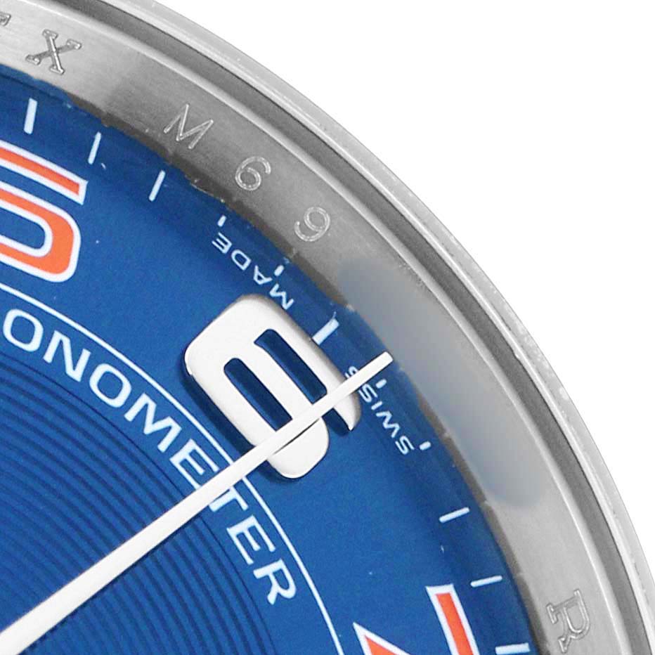 The image shows a close-up of the Rolex Air-King 114200 Men
s Stainless Steel Blue Dial watch face, focusing on the 9 marker and surrounding elements.