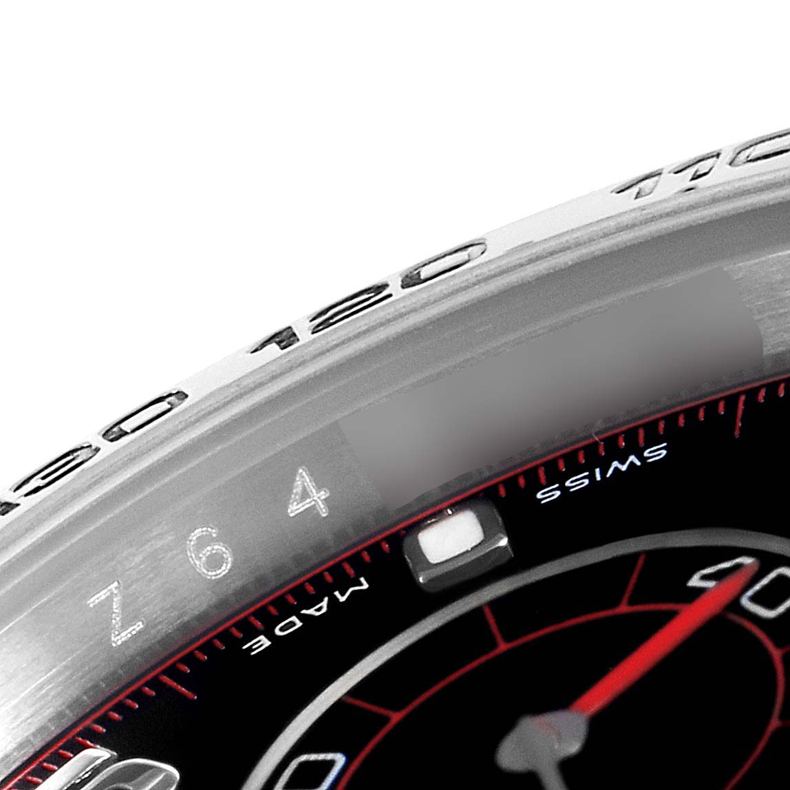 The image shows a close-up of the bezel and part of the dial of a Rolex Daytona 116509 Men's White Gold Black Dial 116509 Men's White Gold Black Dial watch.