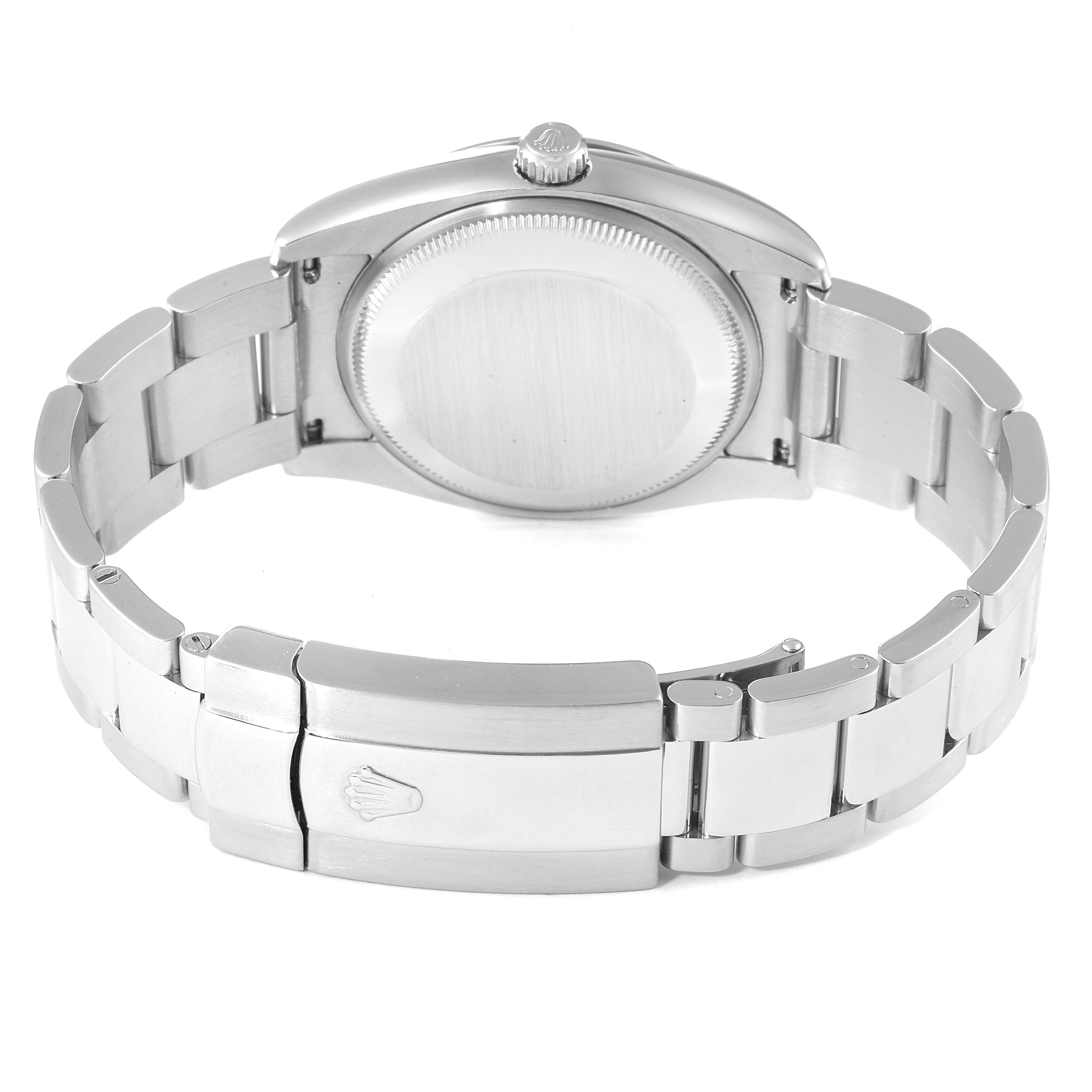 The image shows the back case and bracelet clasp of a Rolex Date 115200 Men's Stainless Steel Black Dial 115200 Men's Stainless Steel Black Dial model watch at a rear angle.