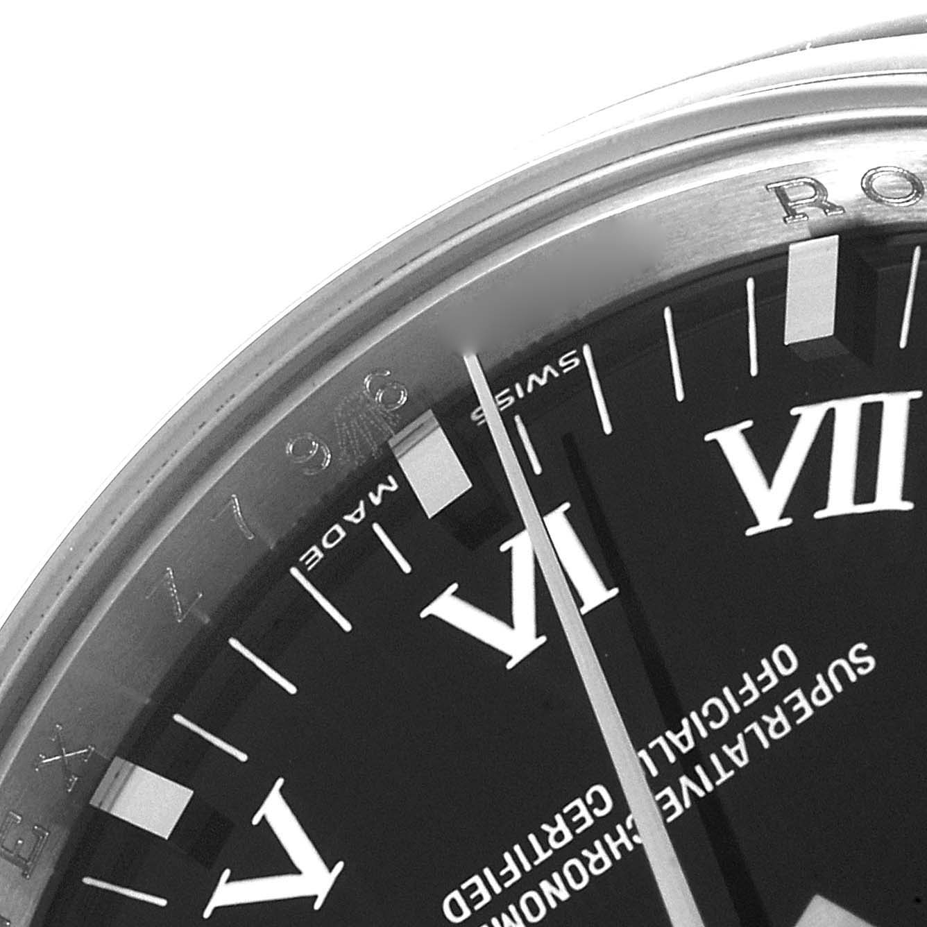 The image shows a close-up angle of the dial and bezel of a Rolex Date 115200 Men's Stainless Steel Black Dial 115200 Men's Stainless Steel Black Dial model watch.