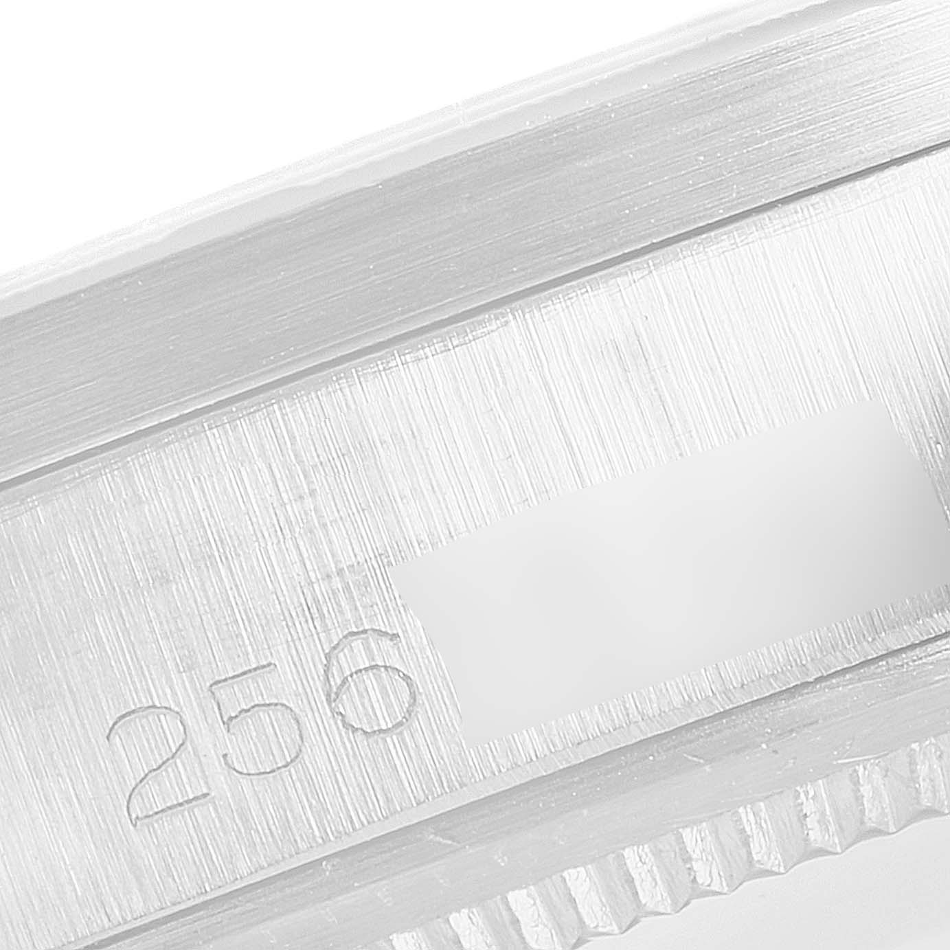 This image shows a close-up angle of the serial number engraving on a Rolex Date 1501 Men's Stainless Steel Silver Dial 1501 Men's Stainless Steel Silver Dial model's case.