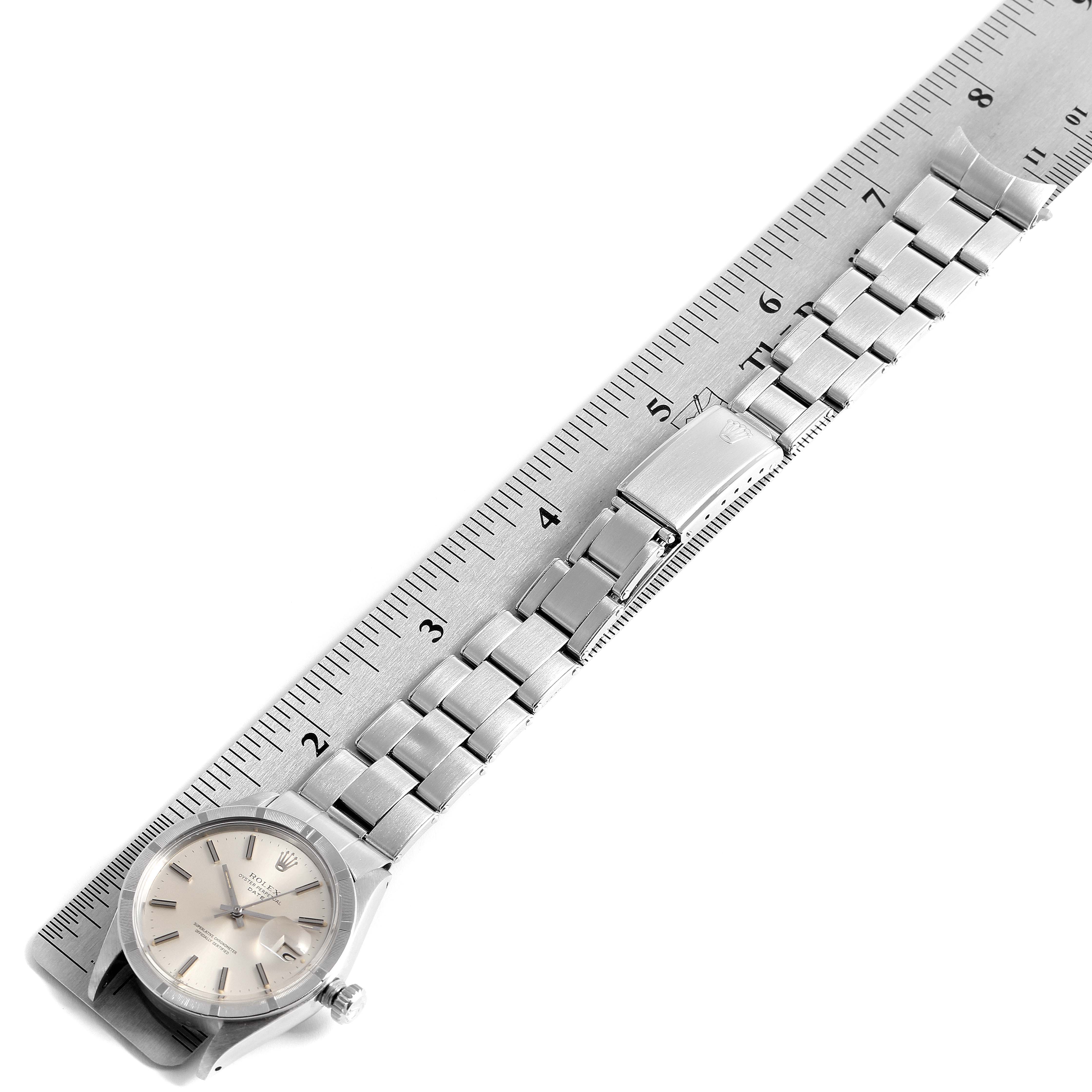 The image shows a Rolex Date 1501 Men's Stainless Steel Silver Dial 1501 Men's Stainless Steel Silver Dial model watch laid flat next to a ruler, displaying the face and full length of the bracelet.