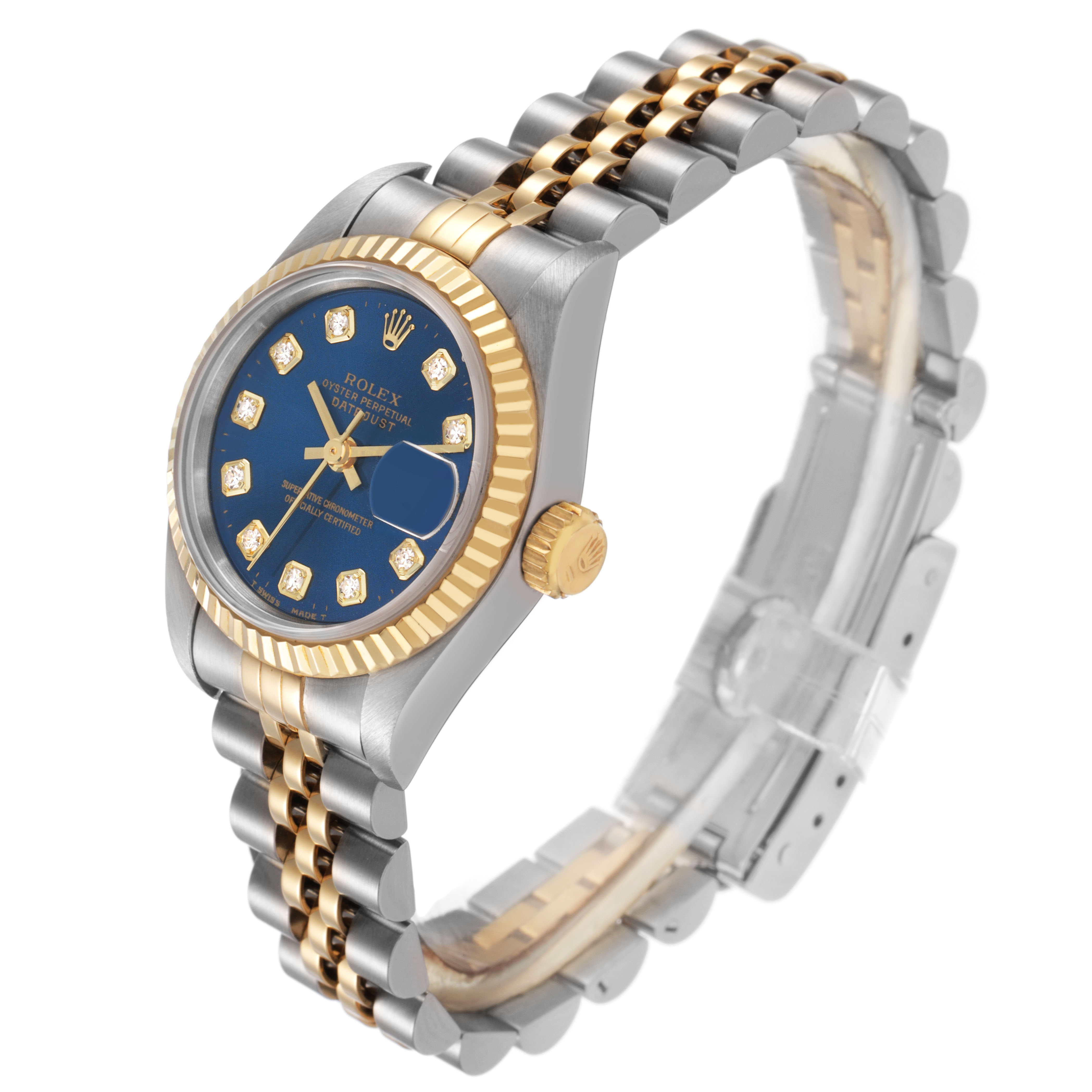 The Rolex Datejust 69173 Women's Steel and Gold (two tone) Blue Dial watch is shown at a side angle, highlighting the blue dial, diamond markers, and two-tone bracelet.