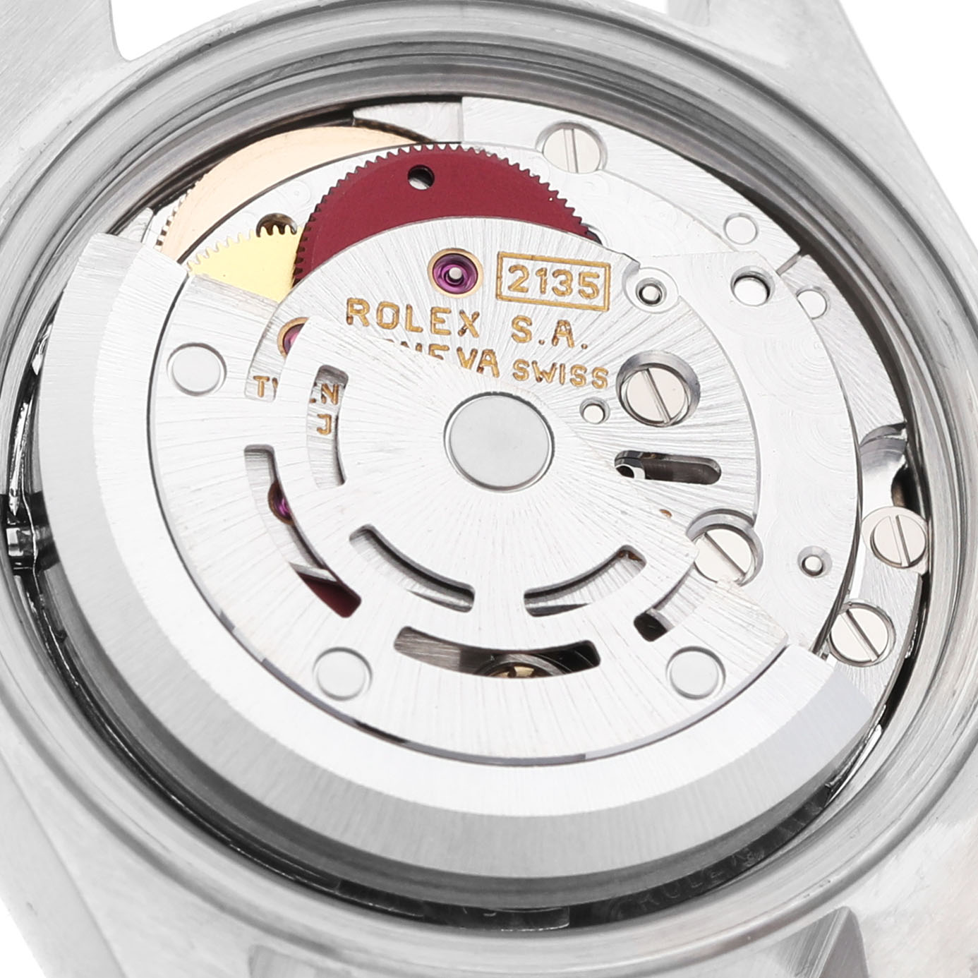 The image shows a close-up of the Rolex Datejust 69173 Women's Steel and Gold (two tone) Blue Dial movement, highlighting gears and inscriptions.