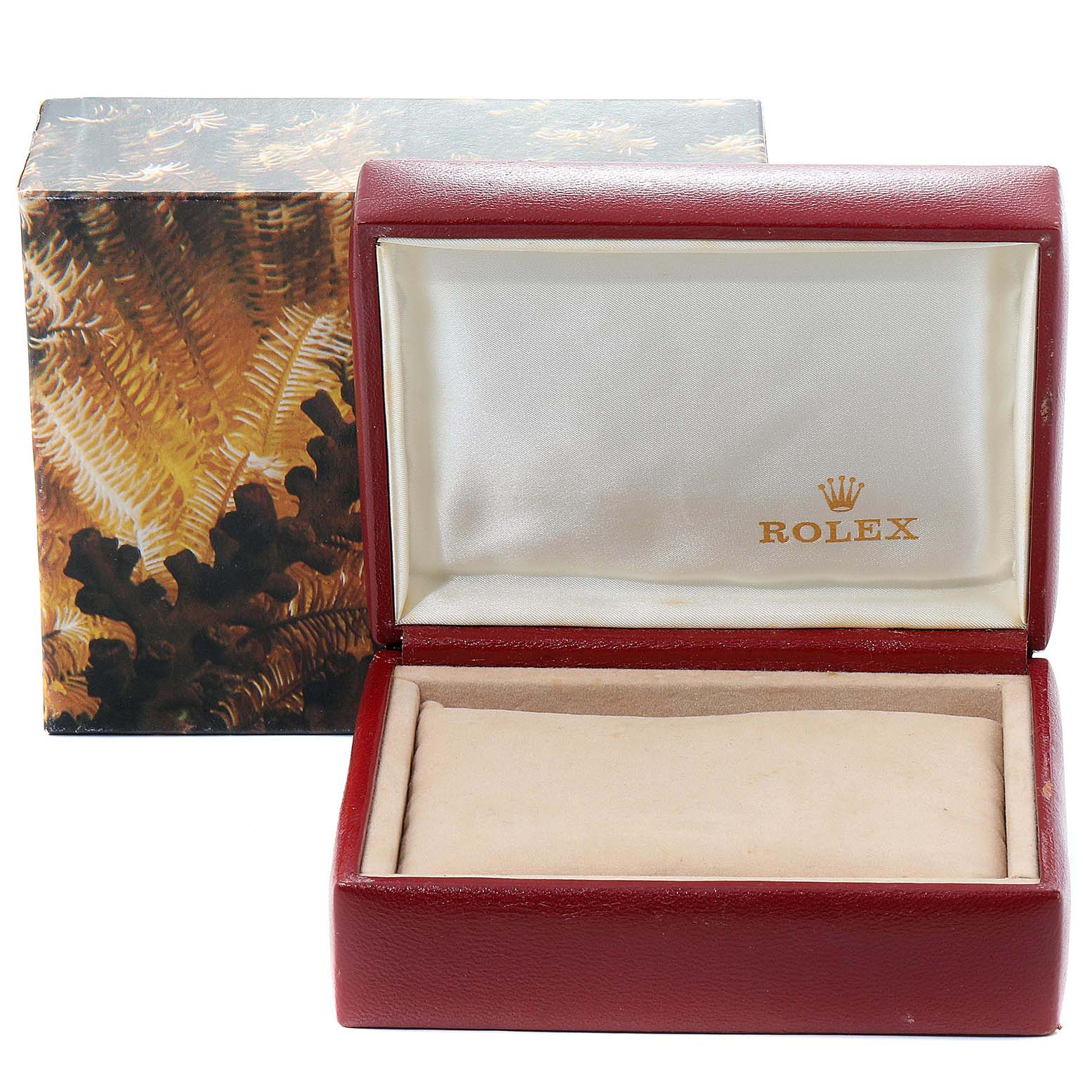 The image shows an open Rolex Datejust 69173 Women's Steel and Gold (two tone) Champagne Dial 69173 Women's Steel and Gold (two tone) Champagne Dial watch box, with a red exterior and a beige interior cushion.