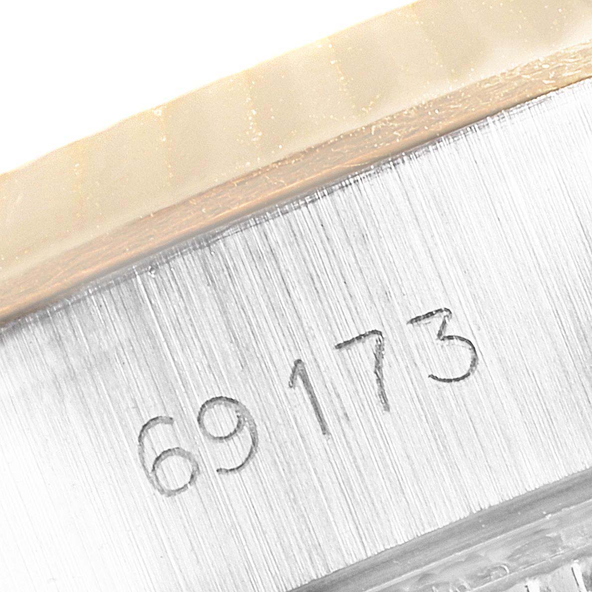 This image shows the engraved model number on the side of a Rolex Datejust 69173 Women's Steel and Gold (two tone) Champagne Dial 69173 Women's Steel and Gold (two tone) Champagne Dial watch case.