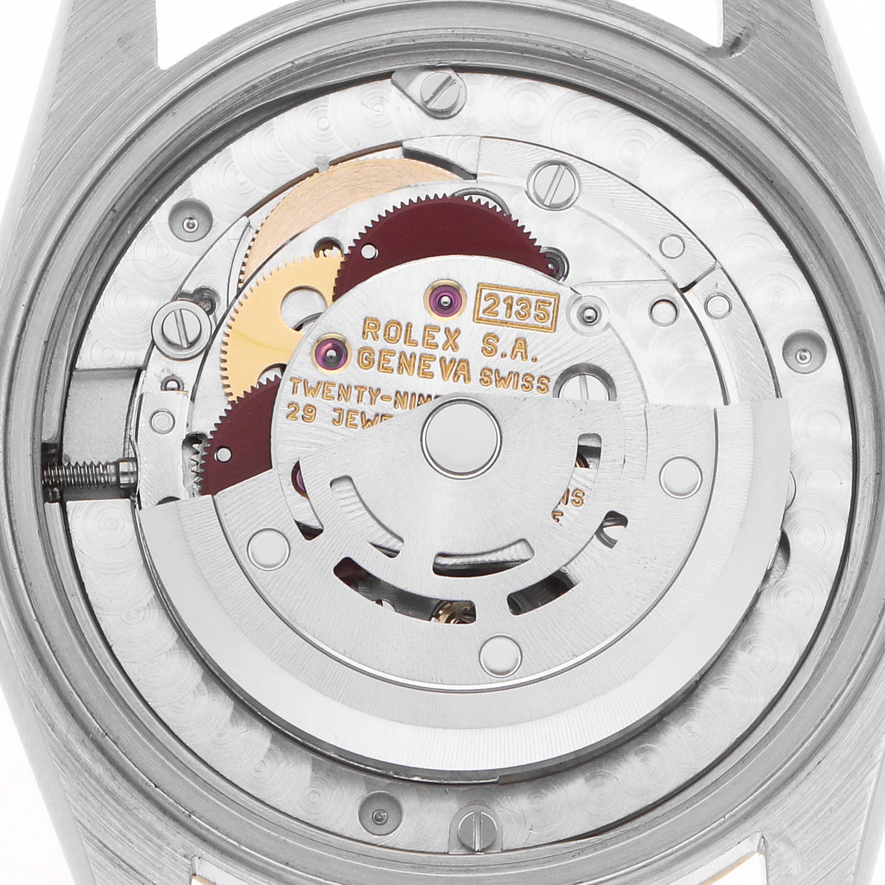 The image shows the back view of a Rolex Mid-Size 68273 Women
s Steel and Gold (two tone) Silver Dial watch, displaying the intricate movement and gears.