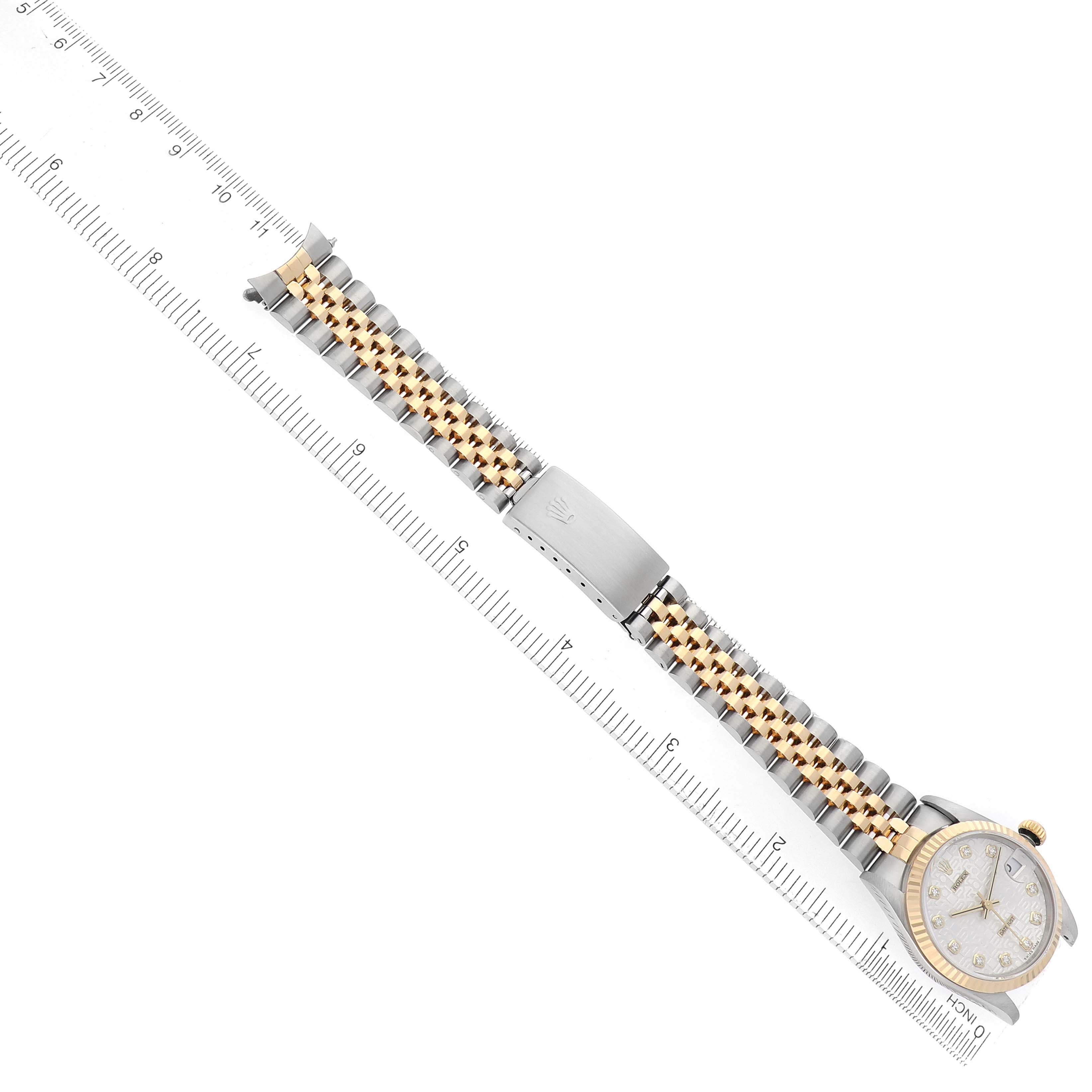 The Rolex Mid-Size 68273 Women
s Steel and Gold (two tone) Silver Dial watch is displayed from a top-down angle, showing the bracelet, clasp, and face.