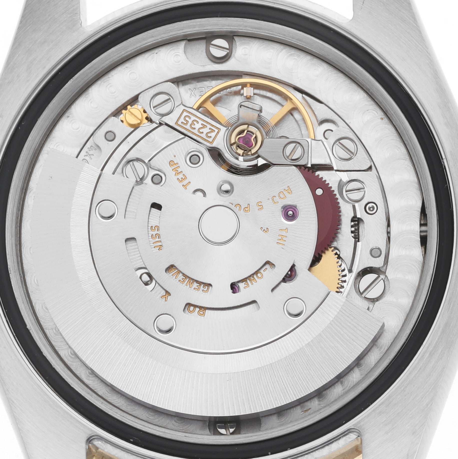 The image shows the internal mechanics of a Rolex Mid-Size 178383 Women
s Steel and Gold (two tone) Silver Dial watch from a top-down angle, revealing gears and the rotor.