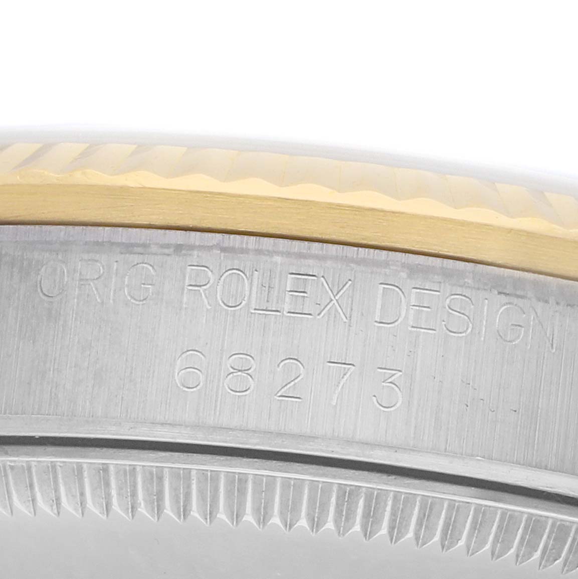 The image shows a close-up of the bezel and engraved model number on a Mid-Size Rolex watch.