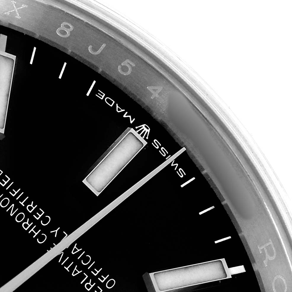 The image shows a close-up of the dial and indices of a Rolex Datejust 126200 Men
s Stainless Steel Black Dial watch, highlighting the "SWISS MADE" text.