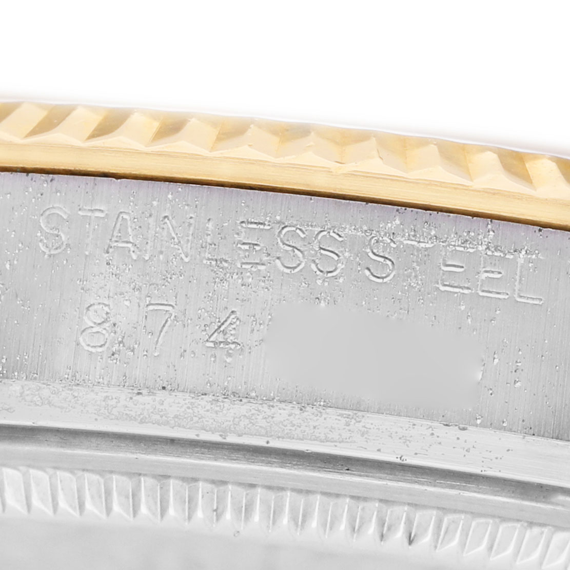 The image shows a close-up of the Rolex Datejust 16013 Men's Steel and Gold (two tone) Champagne Dial's stainless steel case side and edge of the fluted bezel.