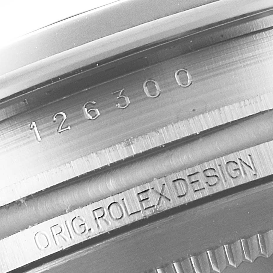 This image shows a close-up of the reference number and "ORIG. ROLEX DESIGN" engraving on a Rolex Datejust 41 126300 Men's Stainless Steel Black Dial 126300 Men's Stainless Steel Black Dial model.