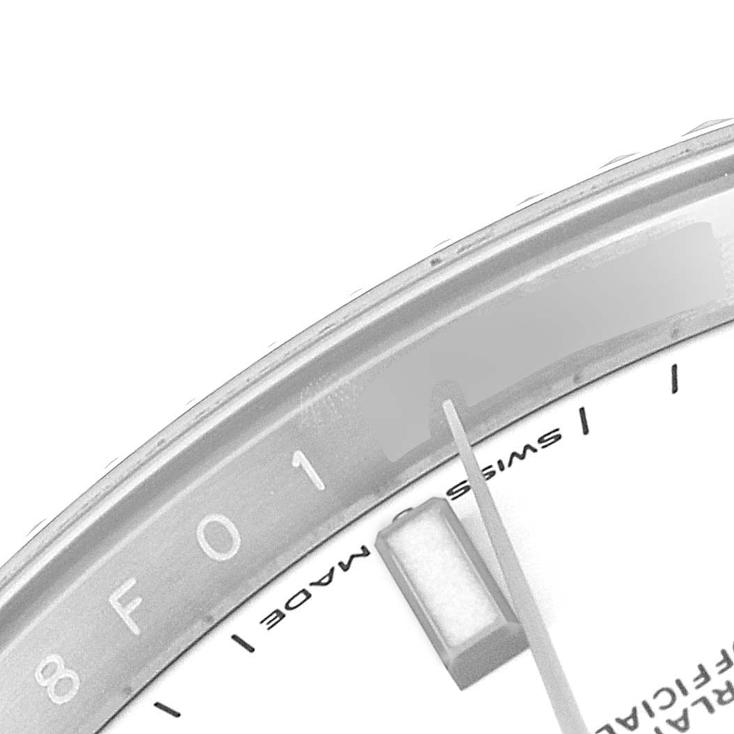 This close-up image of the Rolex Datejust 41 126334 Men
s Stainless Steel White Dial 126334 Men
s Stainless Steel White Dial watch shows the edge of the dial, part of the minute hand, and the Swiss Made marking.