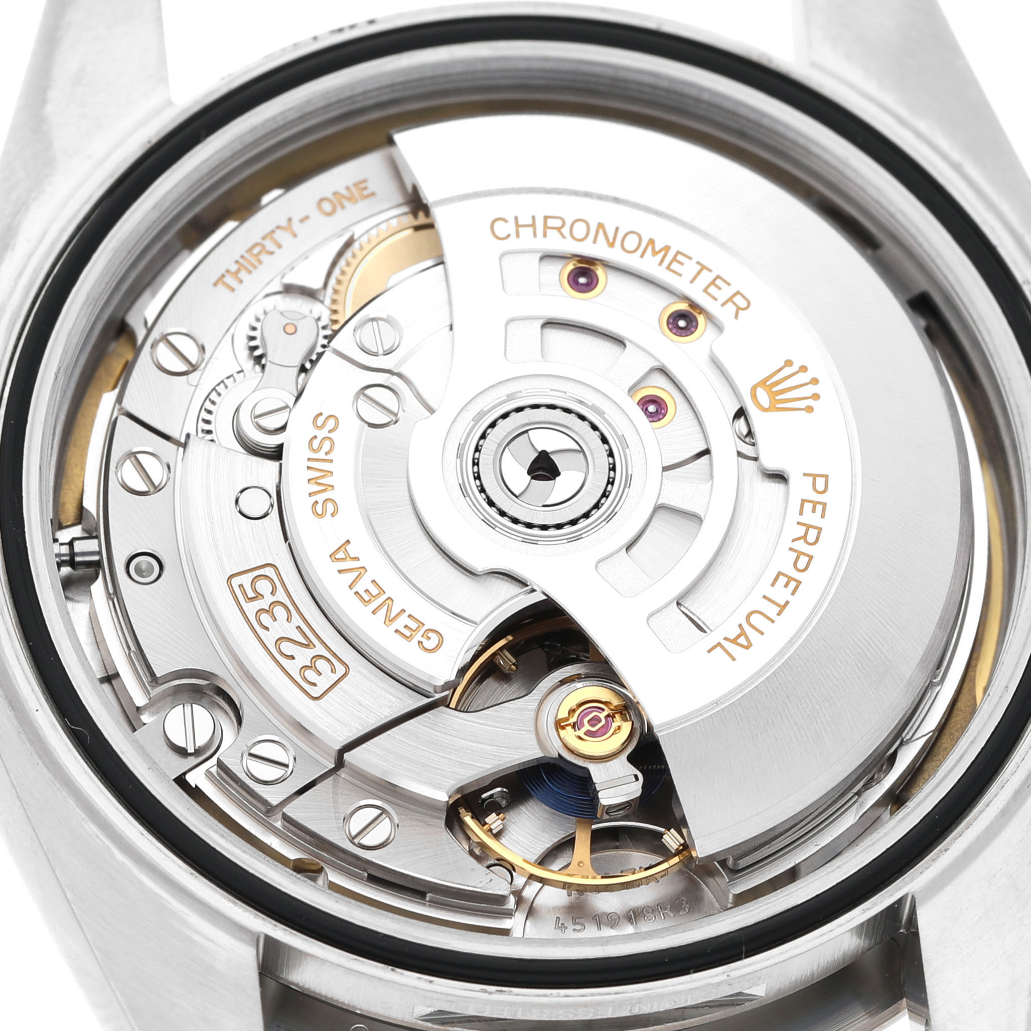 The image shows the open case back of a Rolex Datejust 41 126334 Men's Stainless Steel White Dial, revealing its intricate movement and rotor.