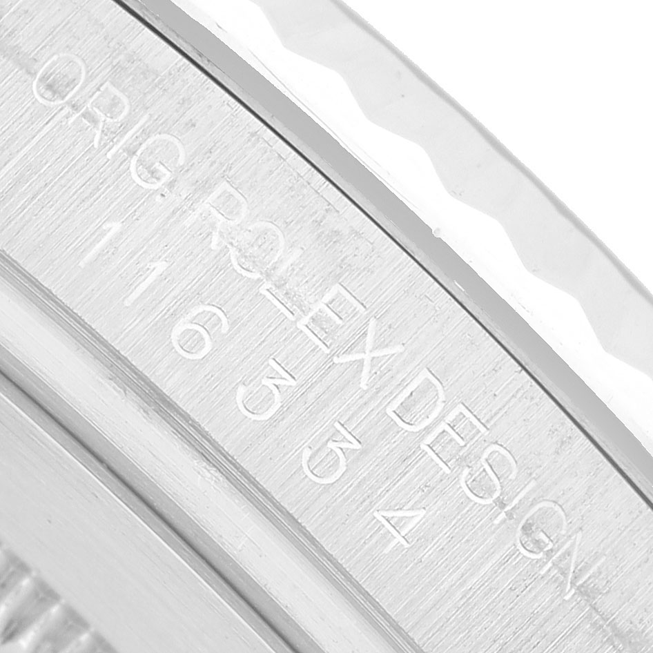The image shows a close-up of the engravings on the Rolex Datejust 41 116334 Men's Stainless Steel Black Dial's case back.