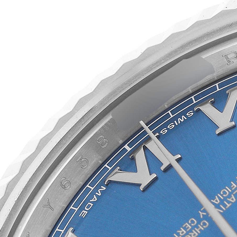 The image shows a close-up of a Rolex Datejust 41 116334 Men's Stainless Steel Blue Dial, focusing on the blue dial, Roman numeral markers, and part of the bezel.